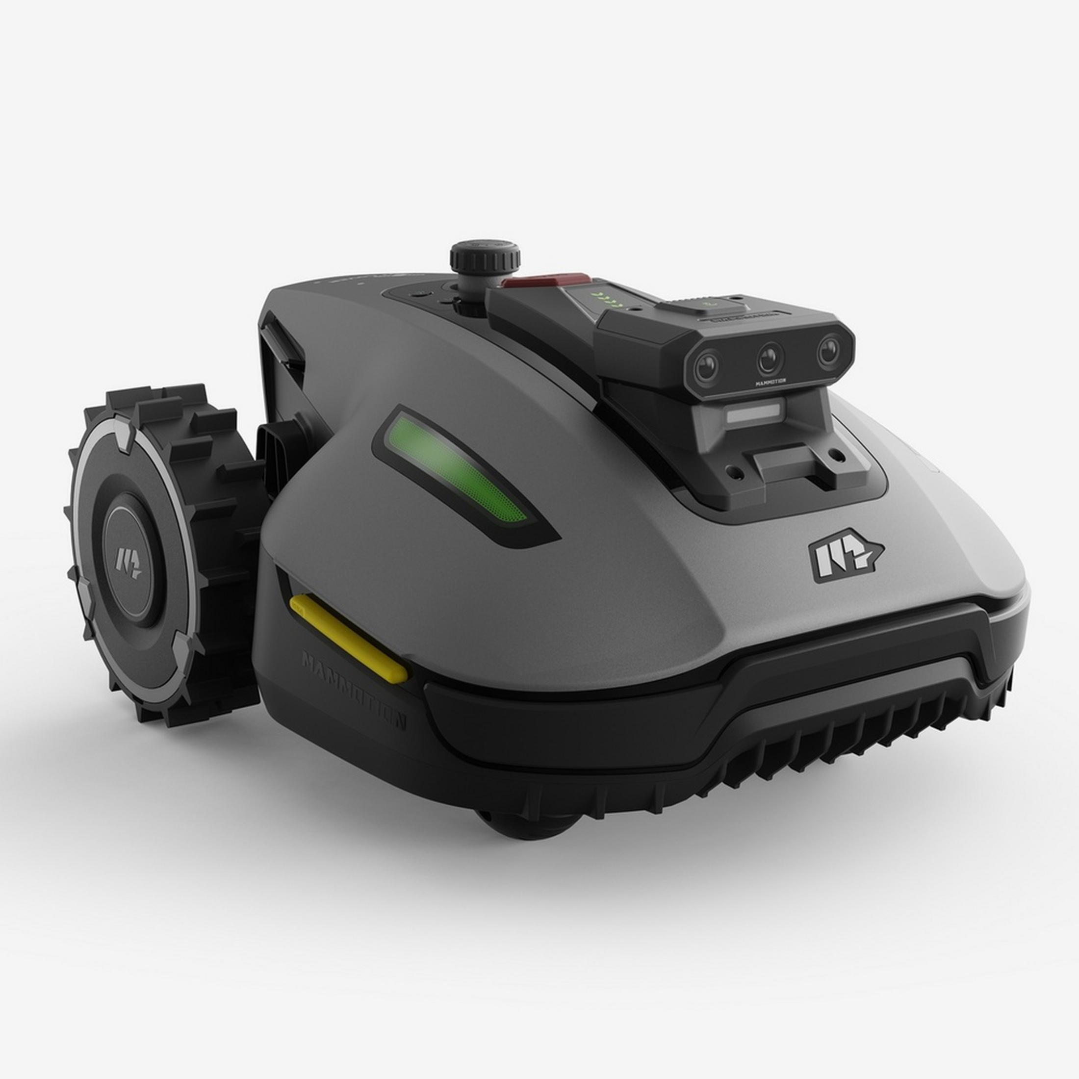 Un robot cortacésped gris con ruedas negras y una unidad de cámara.