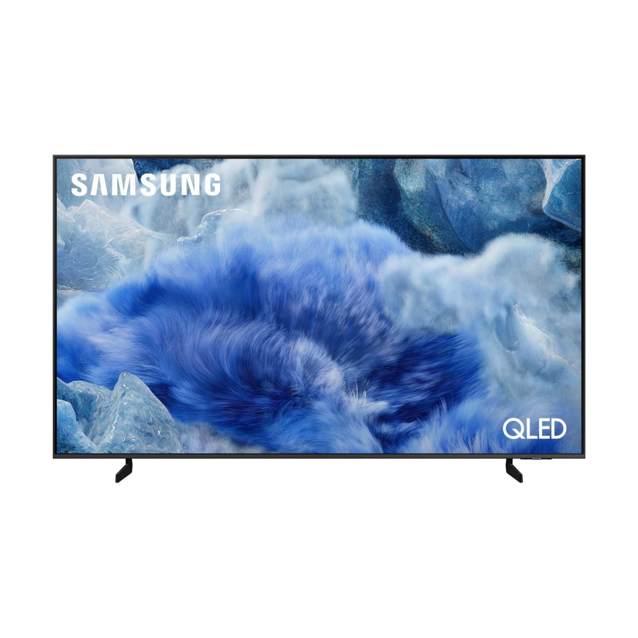 Una TV Samsung QLED con schermo blu poggia su una base.