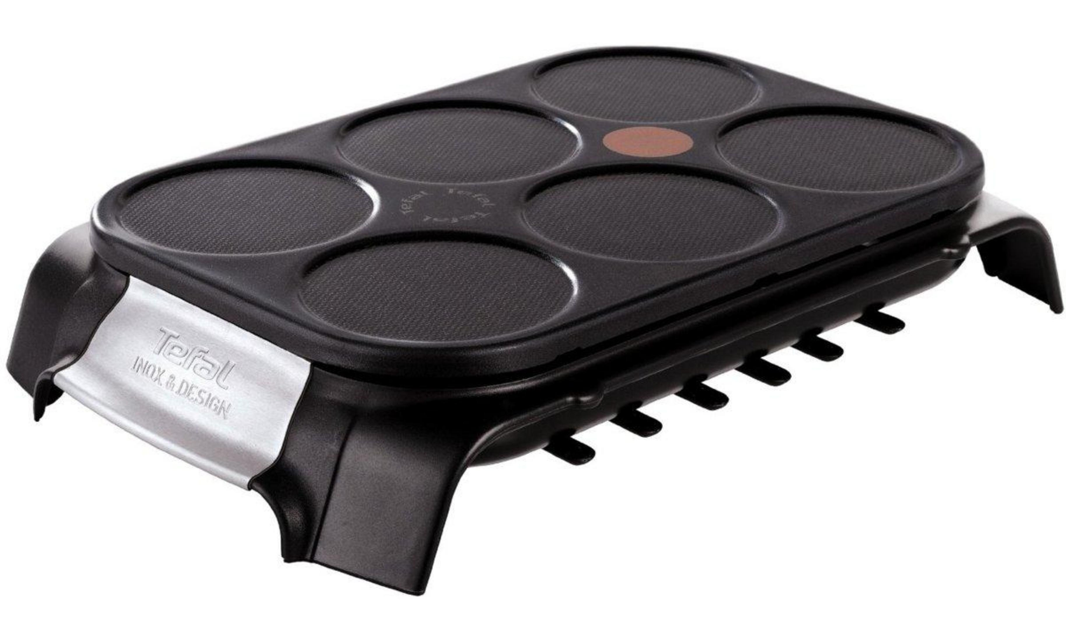 Crepiere nera con sei incavi rotondi e logo Tefal.