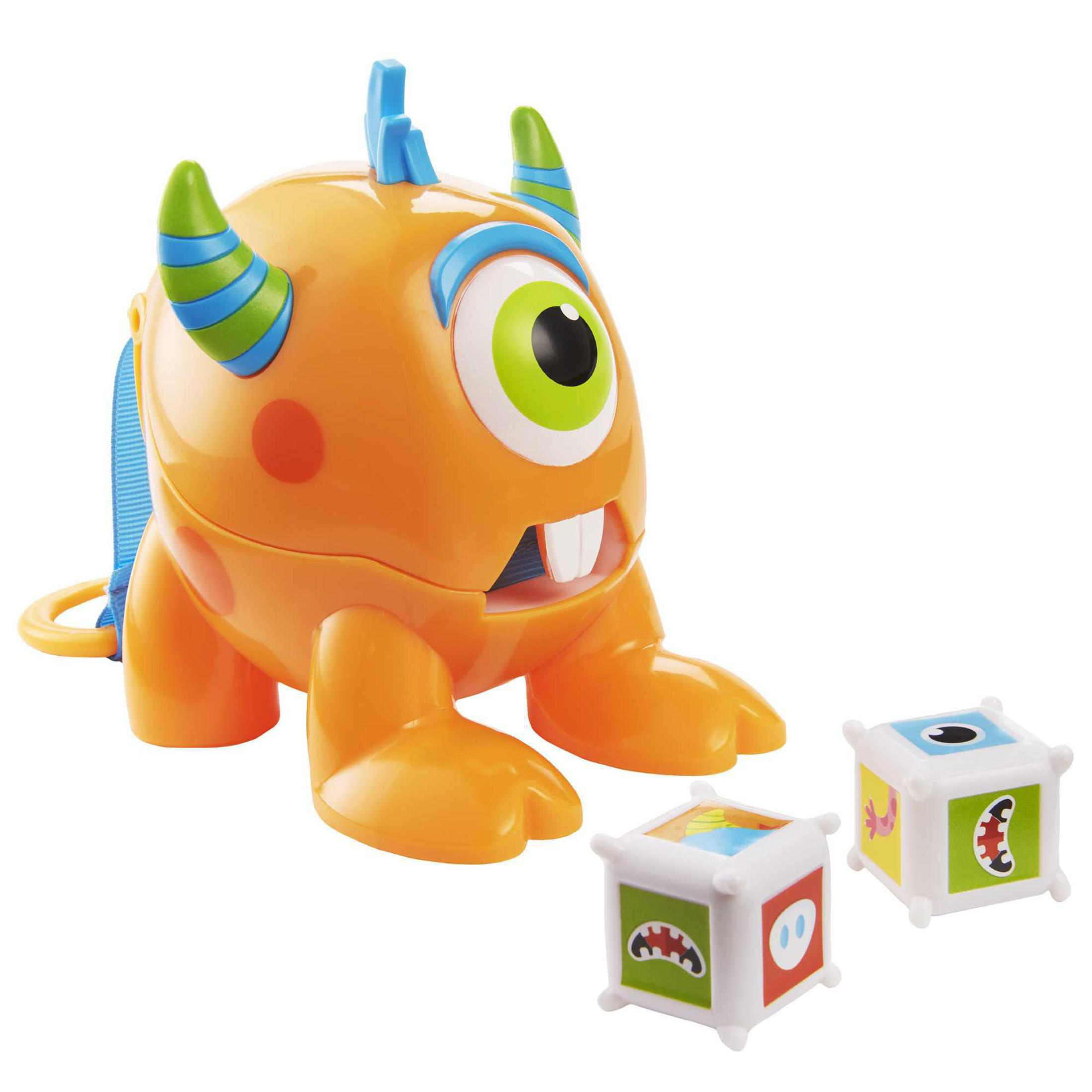 Ein orangefarbener Monsterspielzeug mit blauen und grünen Hörnern und zwei Würfeln.