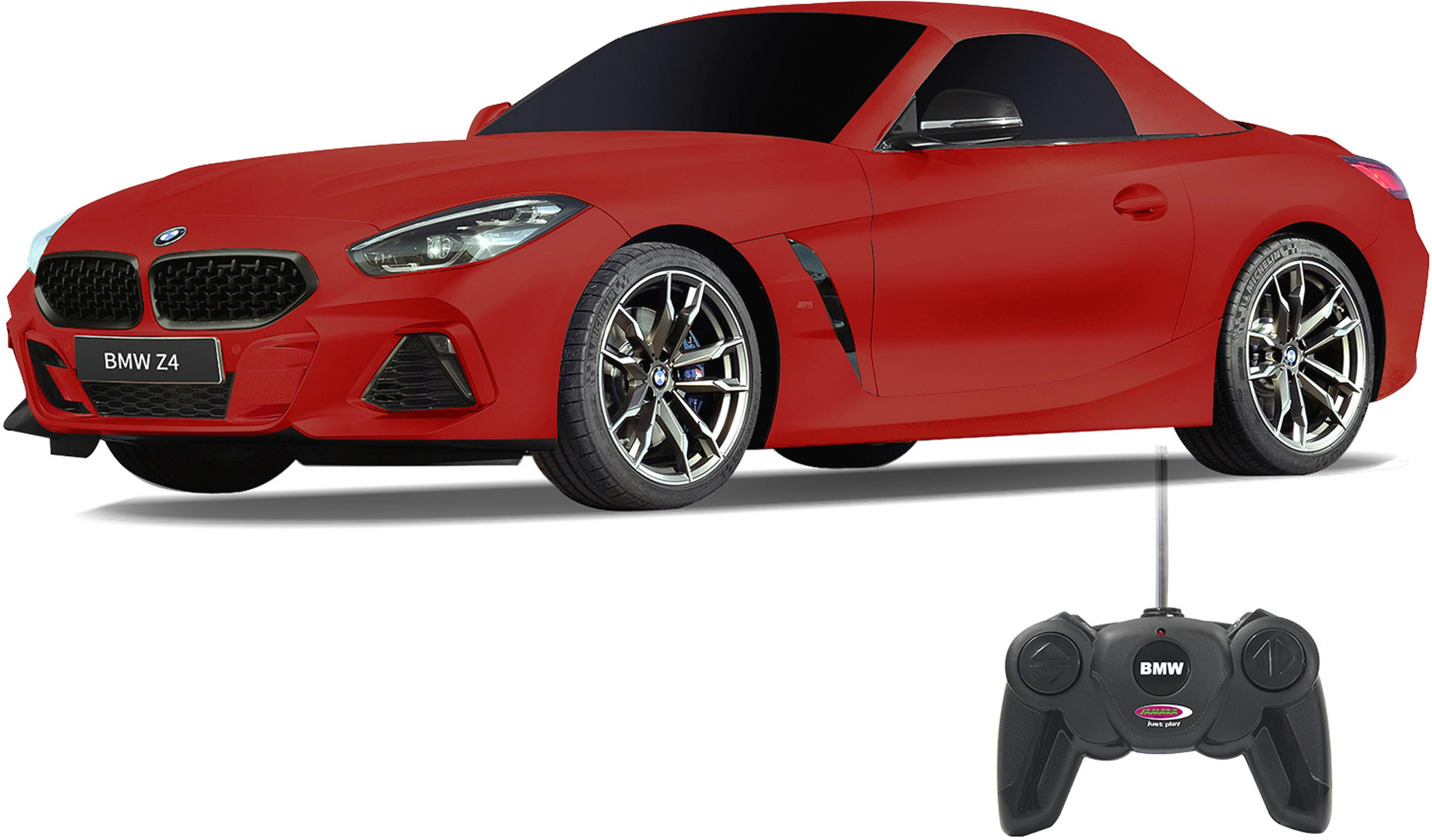 Ein rotes ferngesteuertes BMW Z4 Spielzeugauto mit schwarzem Kühlergrill und Fernbedienung.