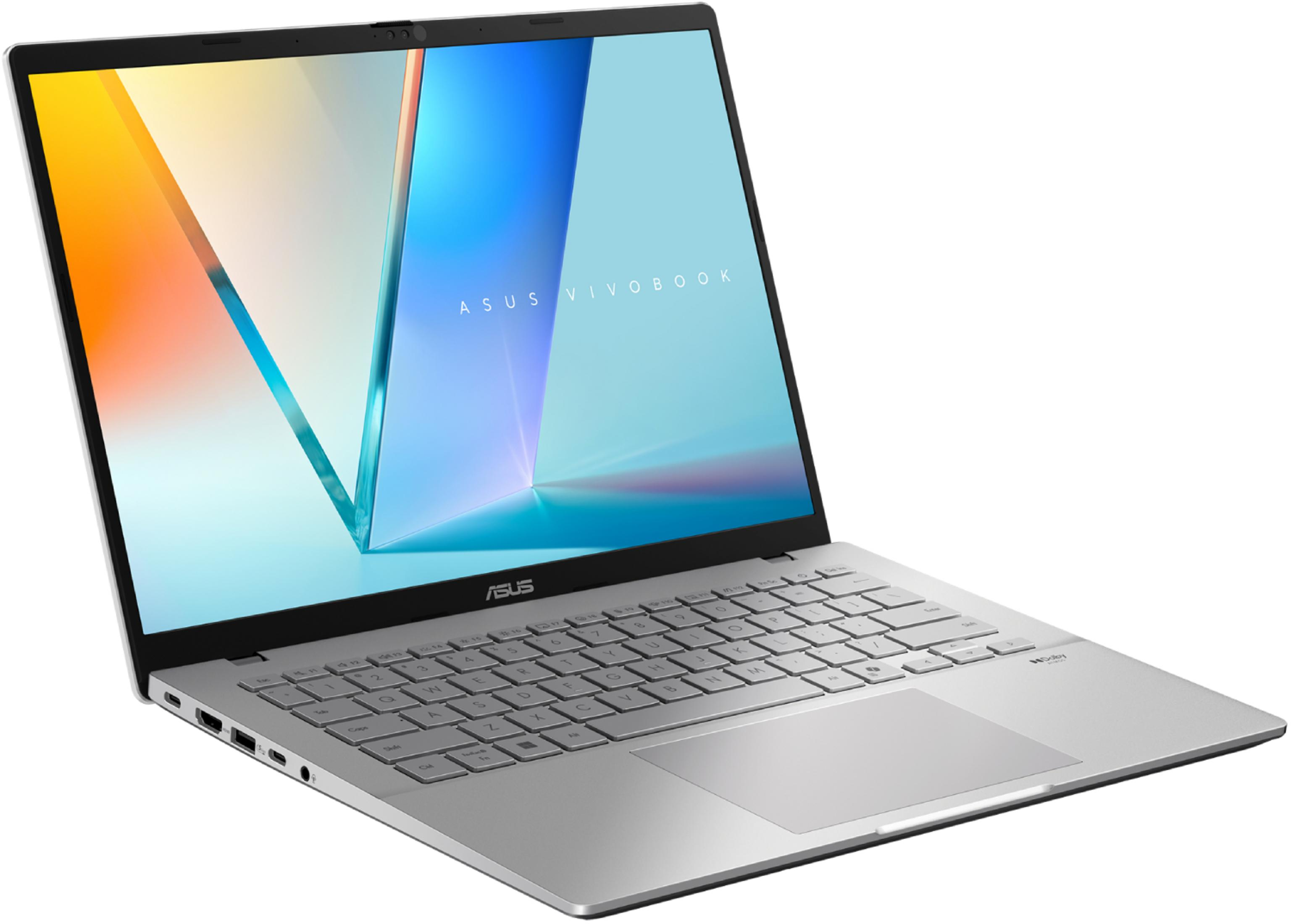 Un portátil plateado Asus Vivobook está abierto, mostrando un fondo colorido.