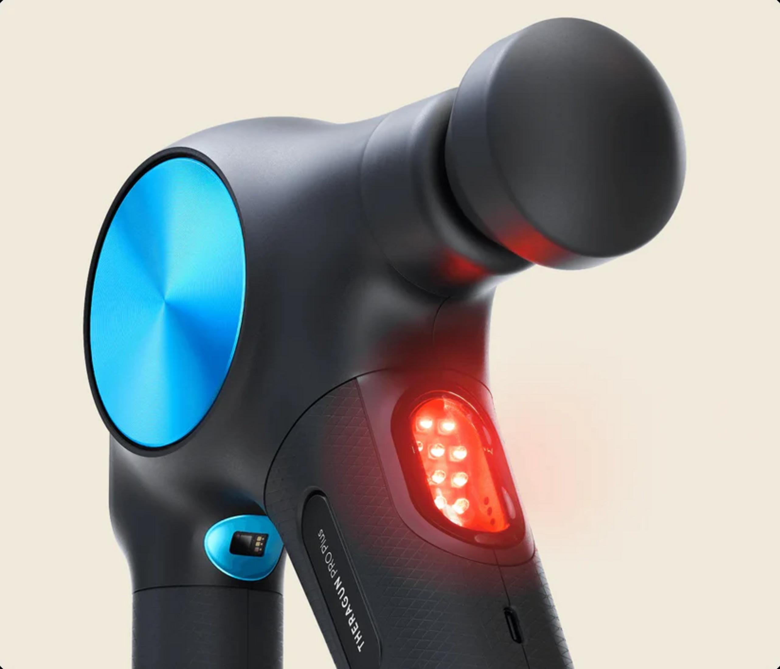 Pistola de masaje negra con disco azul y luces rojas.
