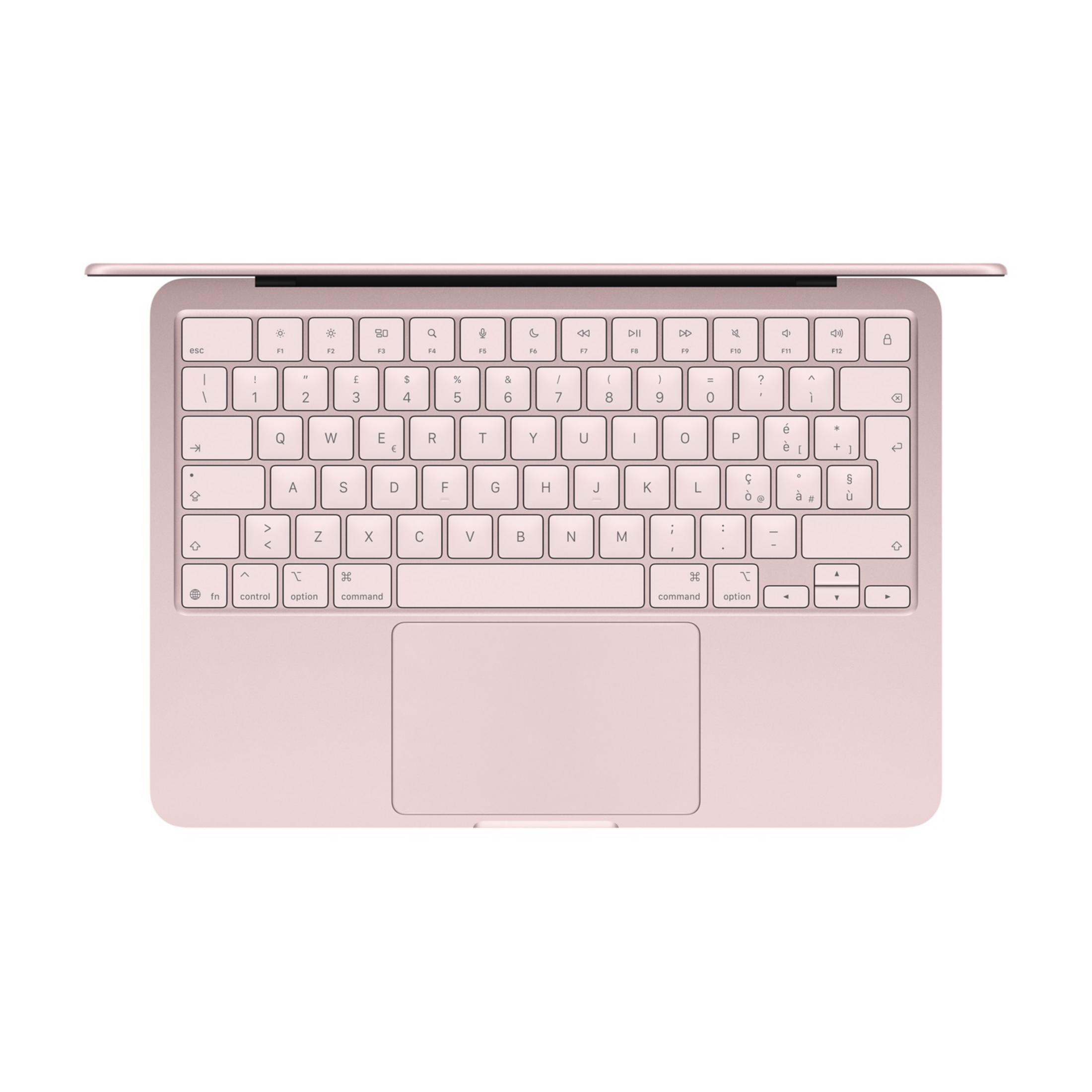 Un laptop rosa è aperto, mostrando tastiera e trackpad.