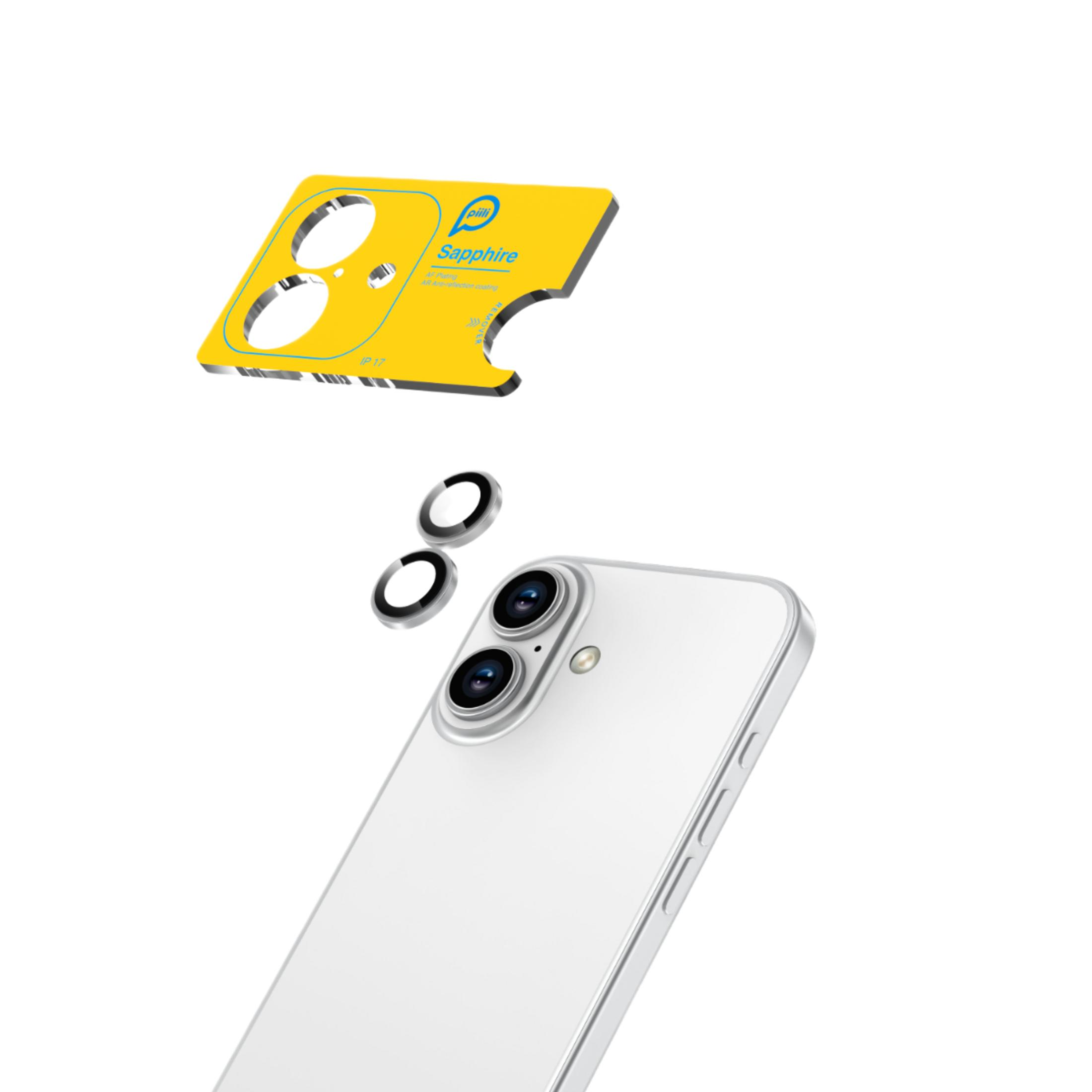 Üç kamera lensli beyaz akıllı telefon üzerinde sarı alet.