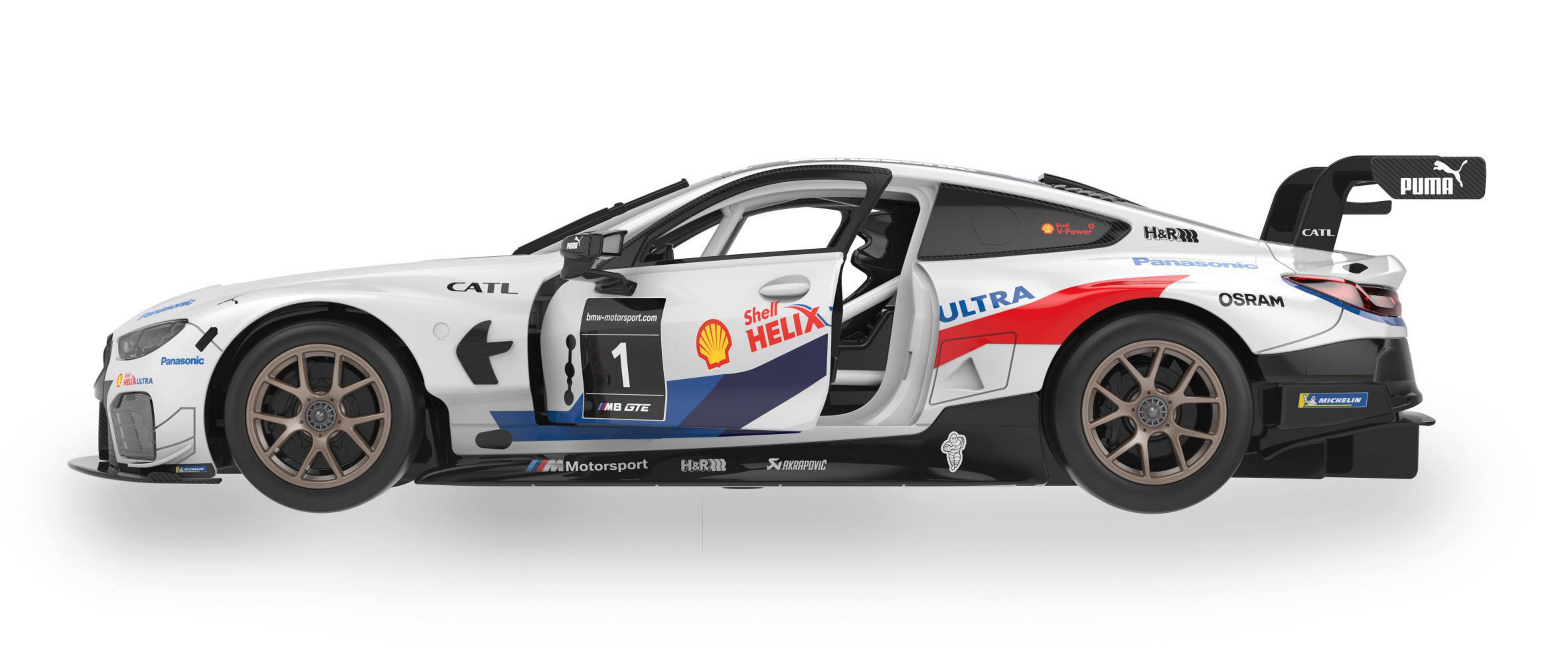 Weißer BMW M8 GTE Rennwagen mit roten, blauen und Shell-Logos. Tür offen.
