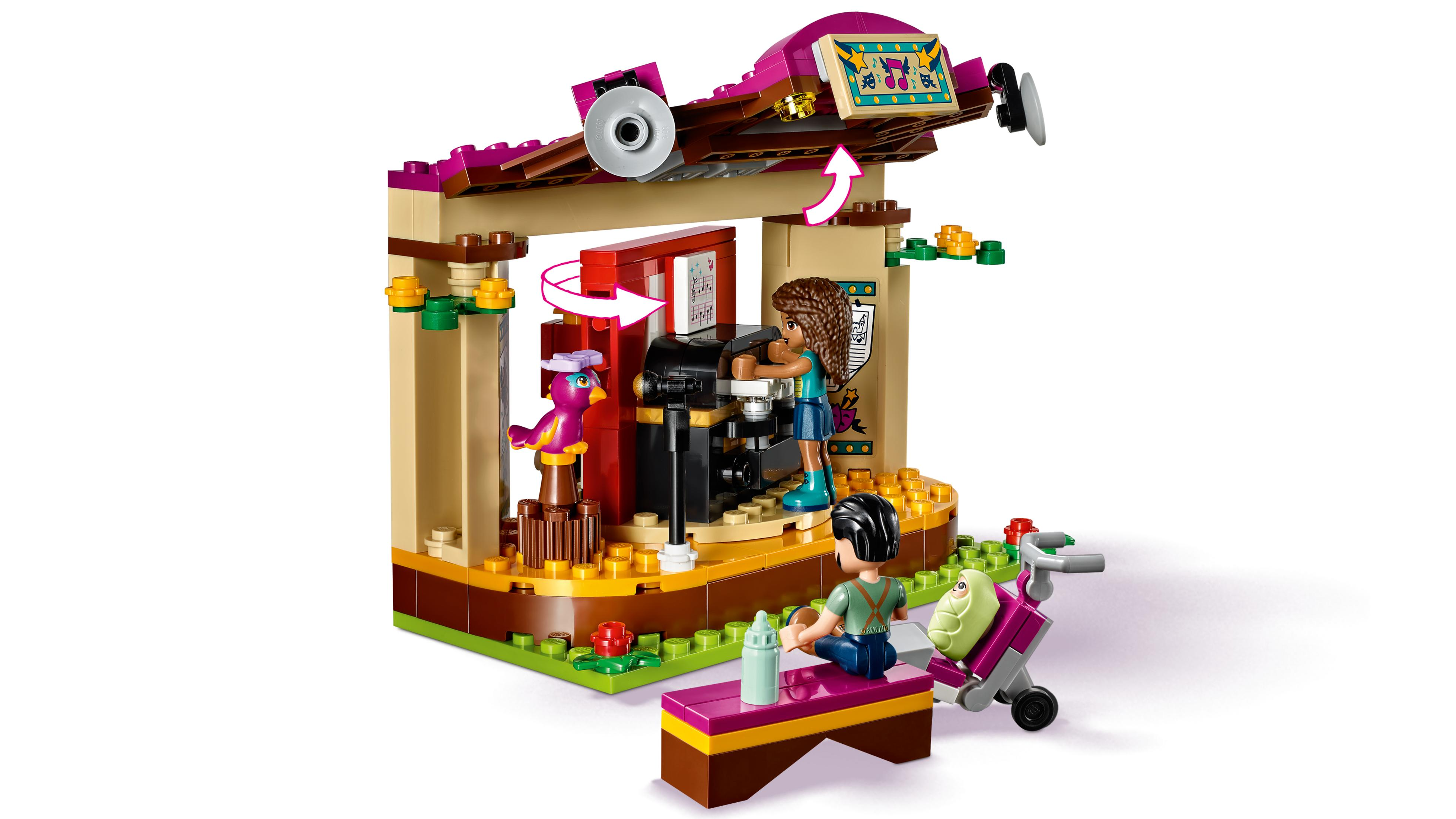Scena Lego colorata con griglia, note musicali e figure.