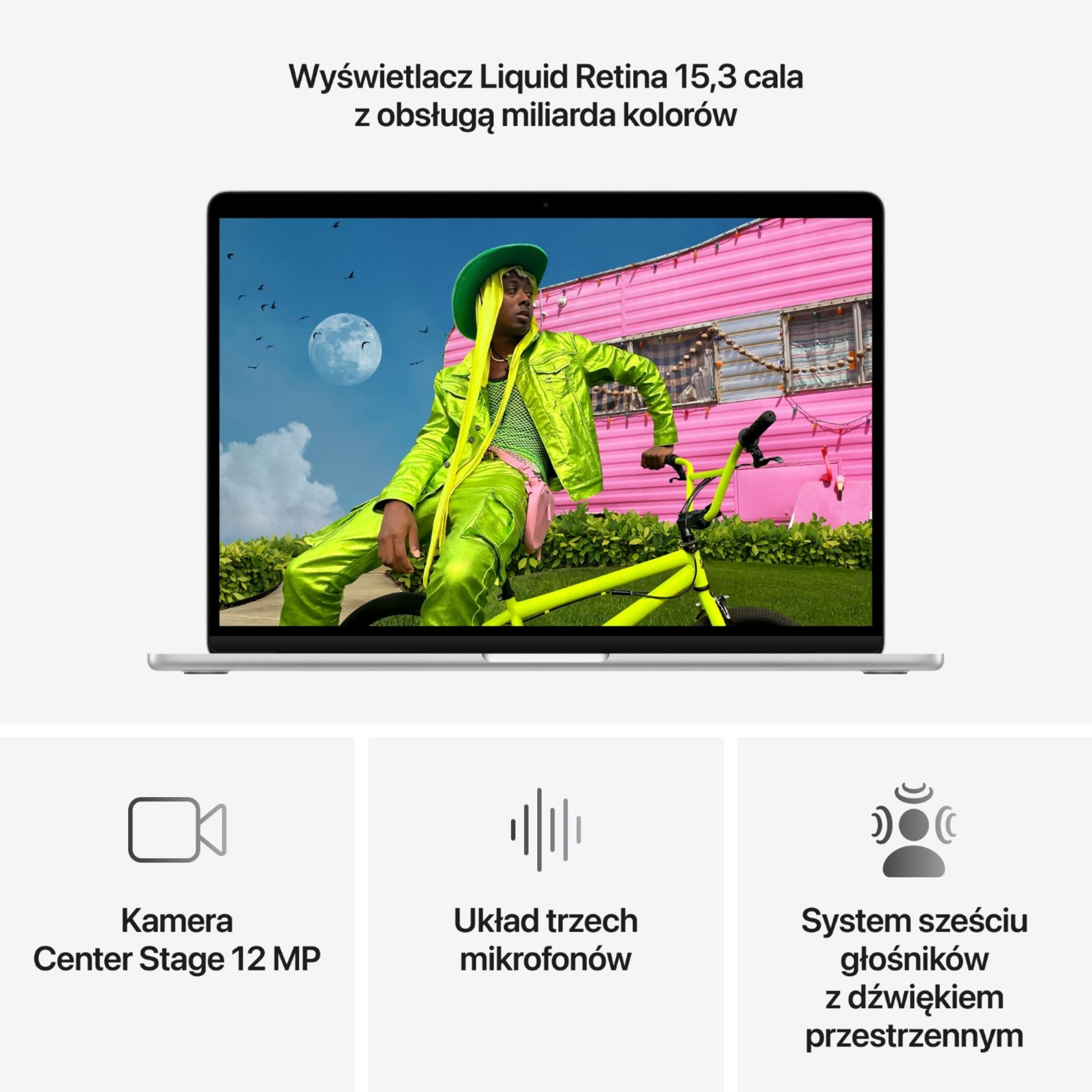 Osoba w neonowo zielonym ubraniu siedzi na żółtym rowerze przed różową przyczepą kempingową.