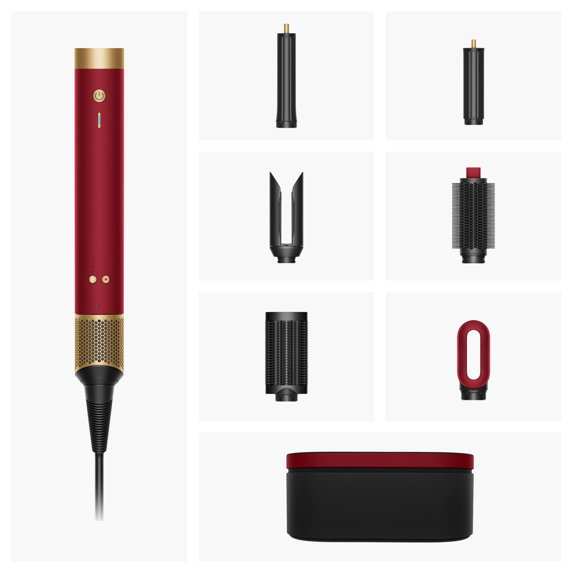Un attrezzo rosso per lo styling dei capelli con cima dorata e accessori.