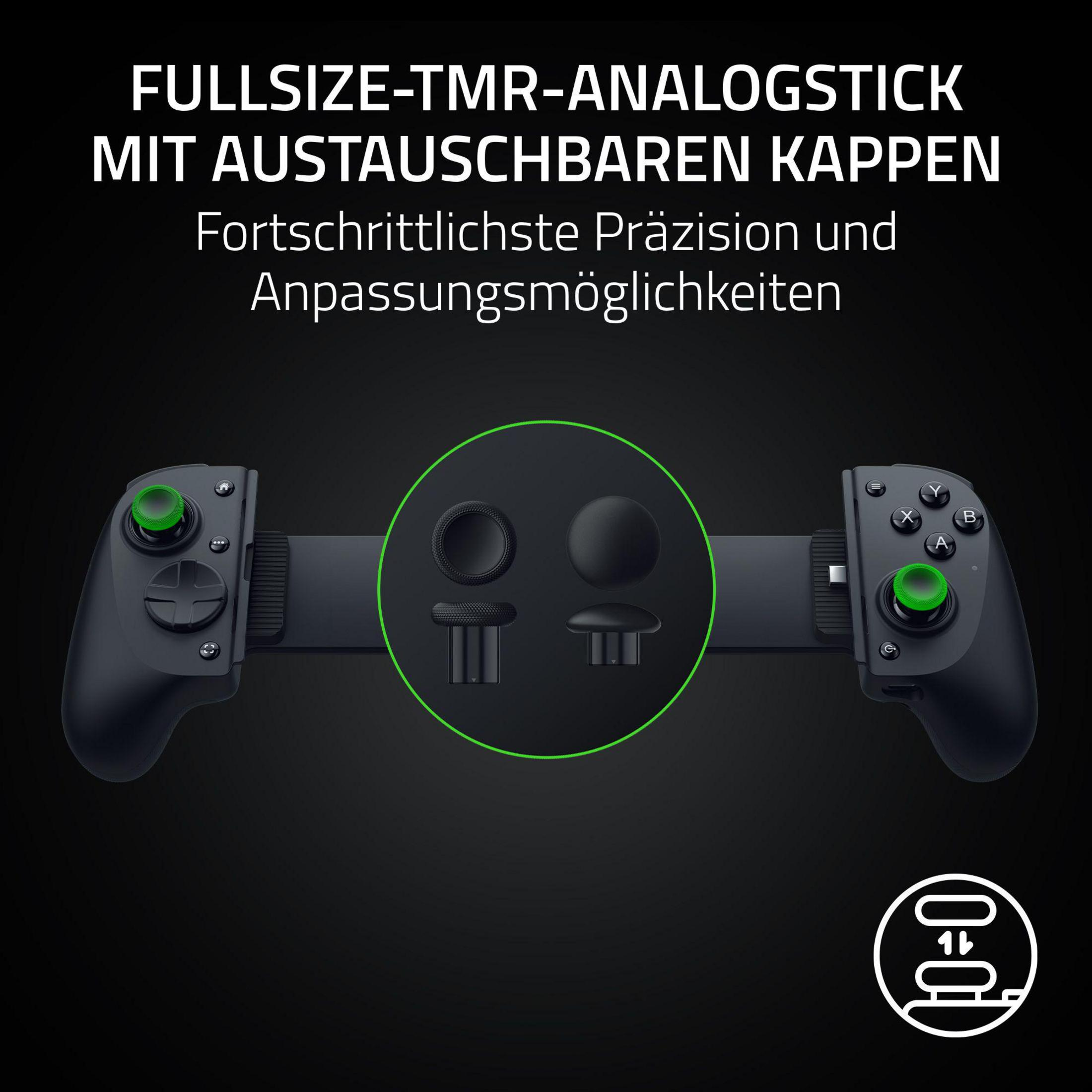 Un controller di gioco nero con joystick intercambiabili e accenti verdi.