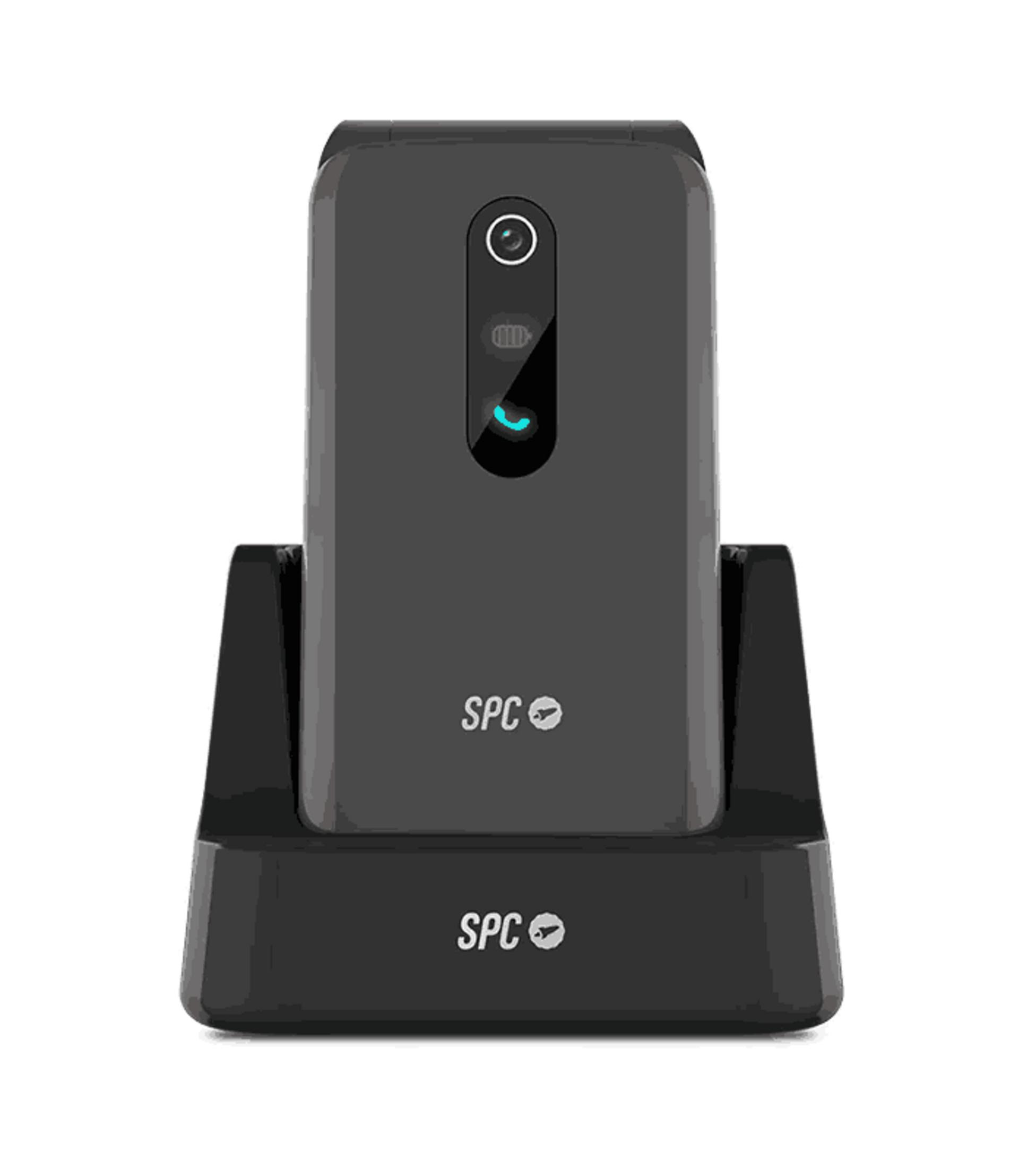 Un telefono SPC grigio è su una base di ricarica nera.