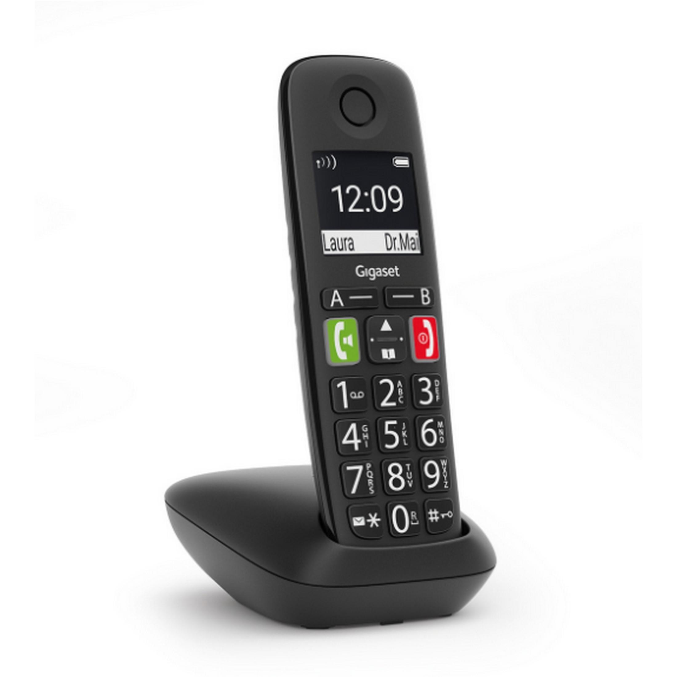 Un telefono cordless Gigaset nero è sulla sua base di ricarica.