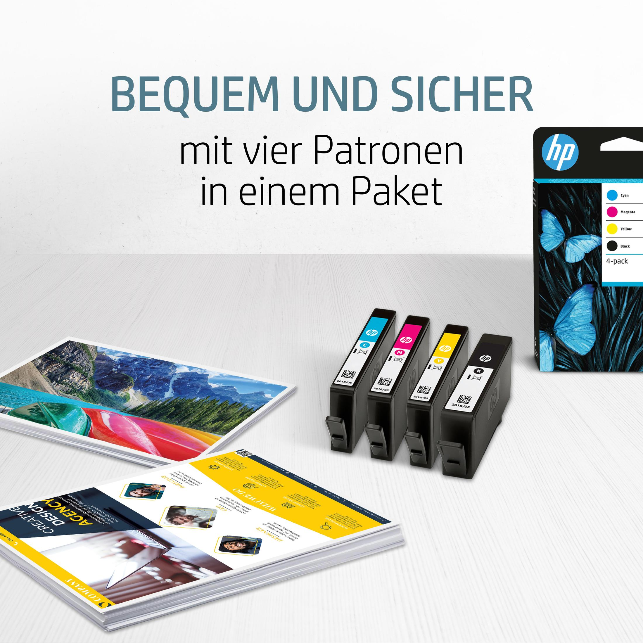 HP printercartridges met vlinderontwerp, brochures en afbeelding op houten tafel.