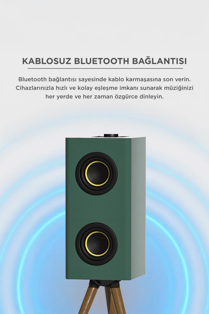İki sürücülü yeşil Bluetooth hoparlör üç ayaklı tabanda duruyor.