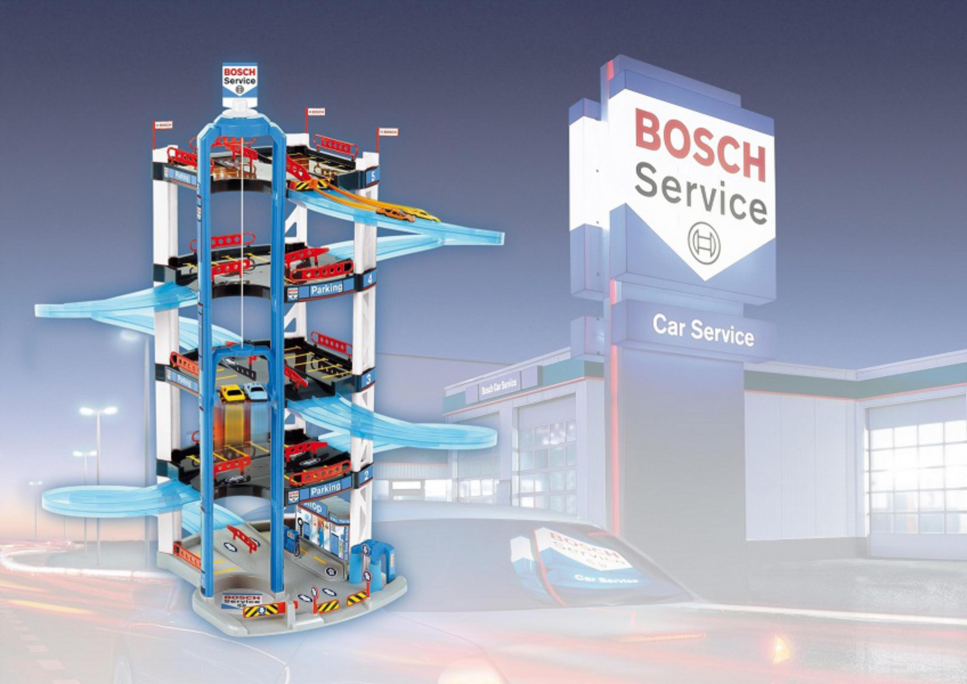 Un parcheggio giocattolo con auto e cartello Bosch Service.
