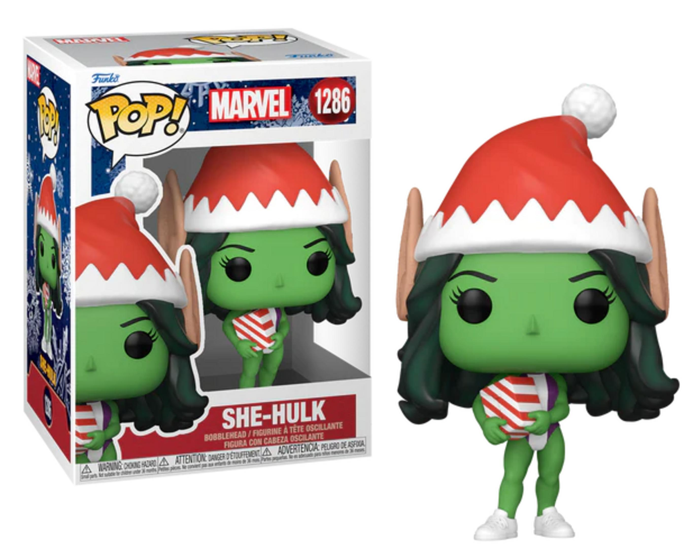 Figura Funko Pop! de She-Hulk con gorro navideño sujeta un regalo.