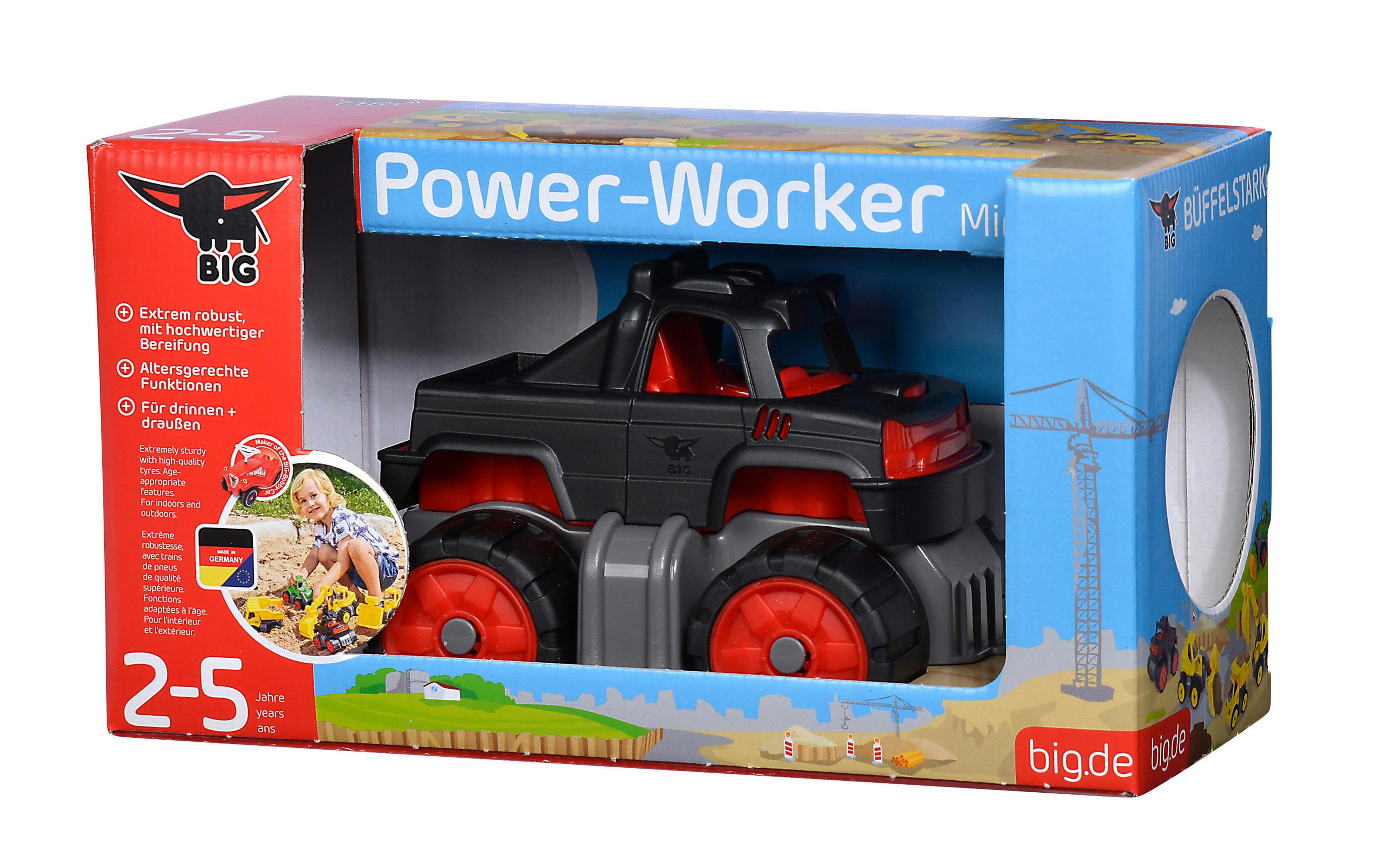 Verpackung eines schwarzen Spielzeug-LKWs mit großen roten Rädern und der Aufschrift 'Power-Worker'