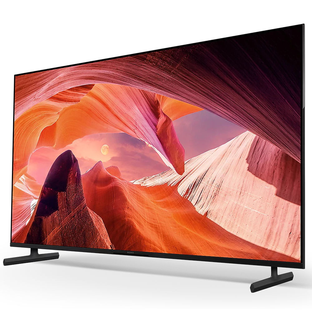 Ein geschwungener Fernseher zeigt eine Canyonlandschaft mit einer Mondsichel.