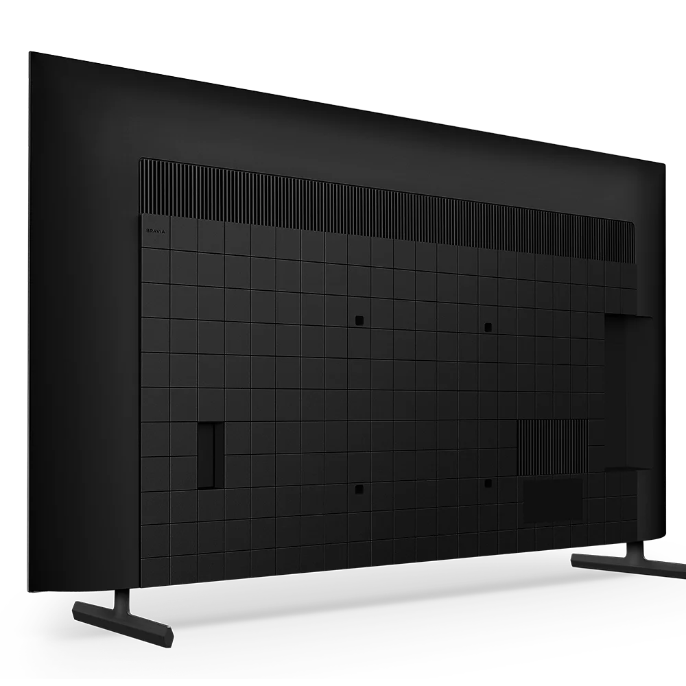 Rückseite eines schwarzen Fernsehers mit Belüftungsschlitzen und Kacheldesign.