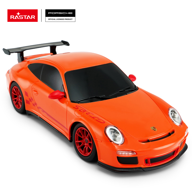 Pomarańczowy samochodzik Porsche GT3 RS z czerwonymi felgami i spojlerem.