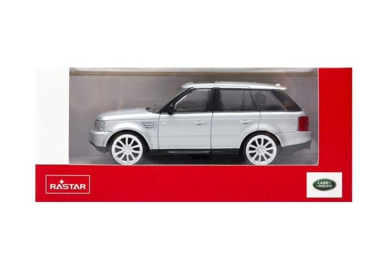 Srebrny samochódzik Range Rover w czerwonym opakowaniu z logo Land Rover.