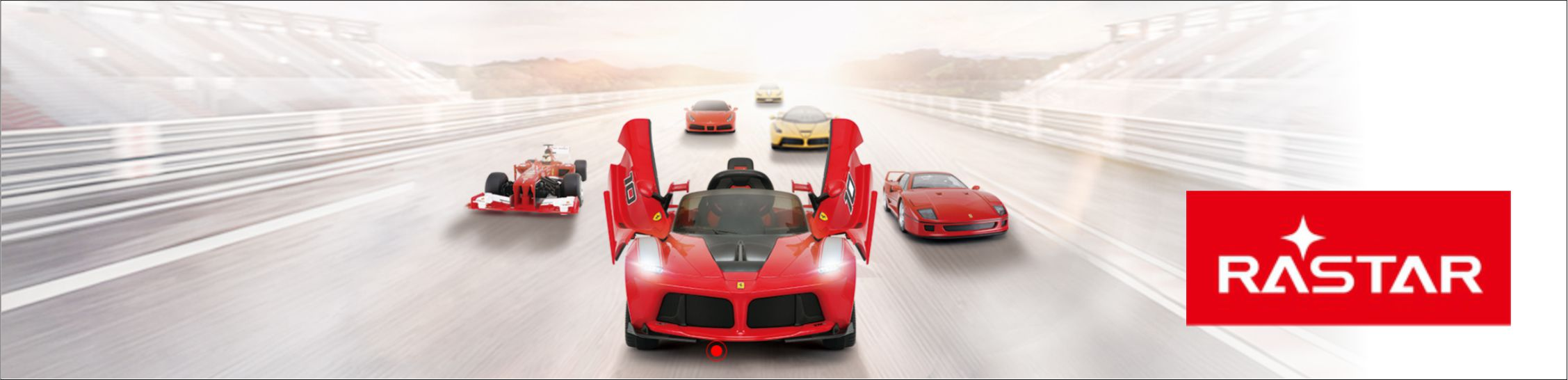 Kilka samochodów wyścigowych, w tym czerwony Ferrari z otwartymi drzwiami, na torze wyścigowym.