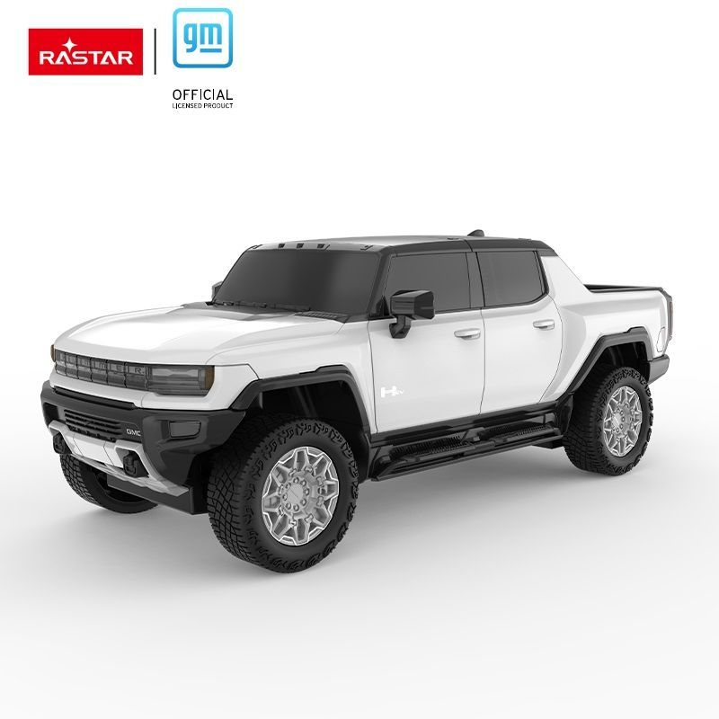 Biały pickup GMC Hummer EV z czarnym dachem i kołami.