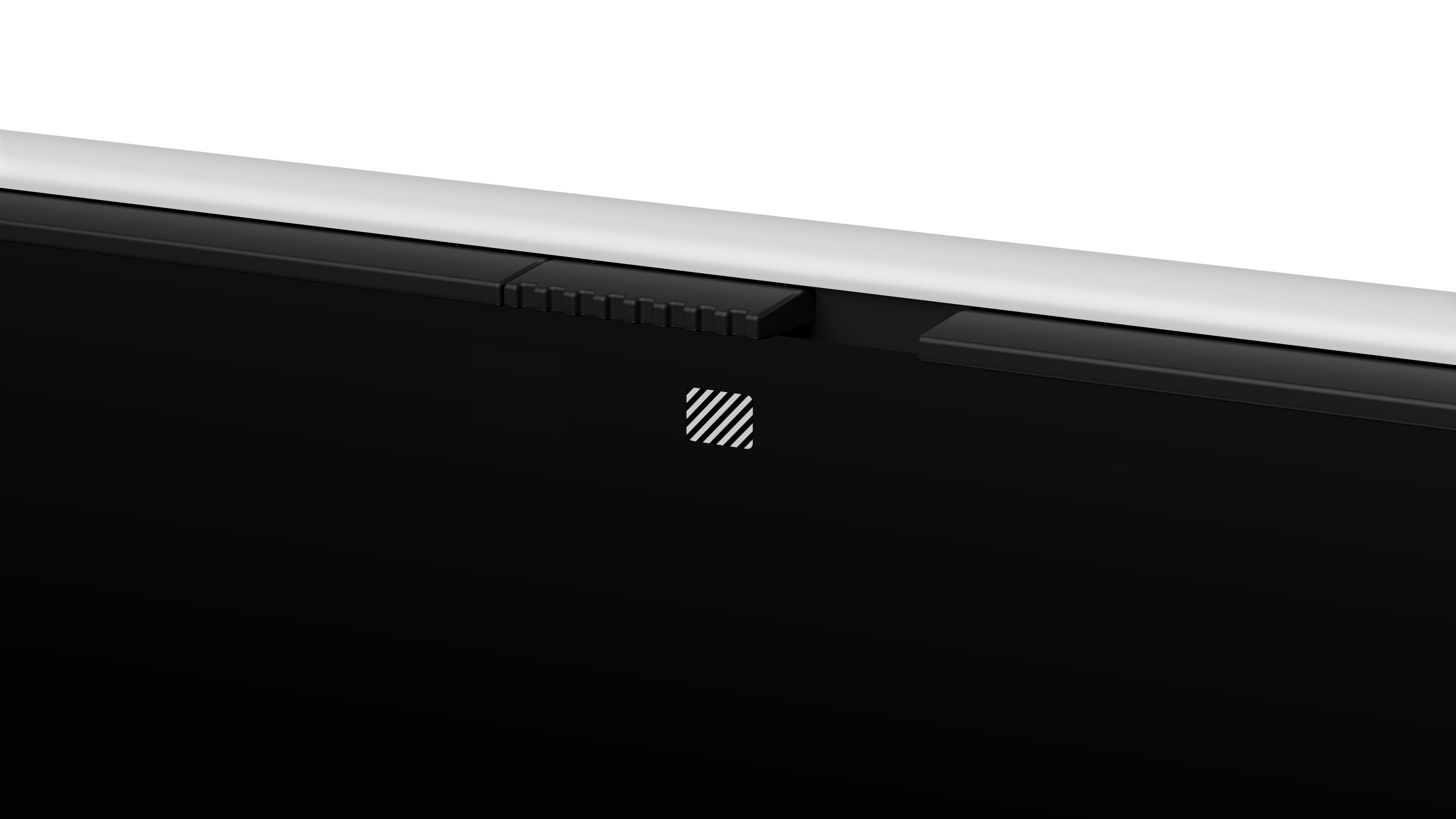 Nahaufnahme eines schwarzen Tablet-Bildschirms mit silbernem Rahmen und kleinem Symbol.