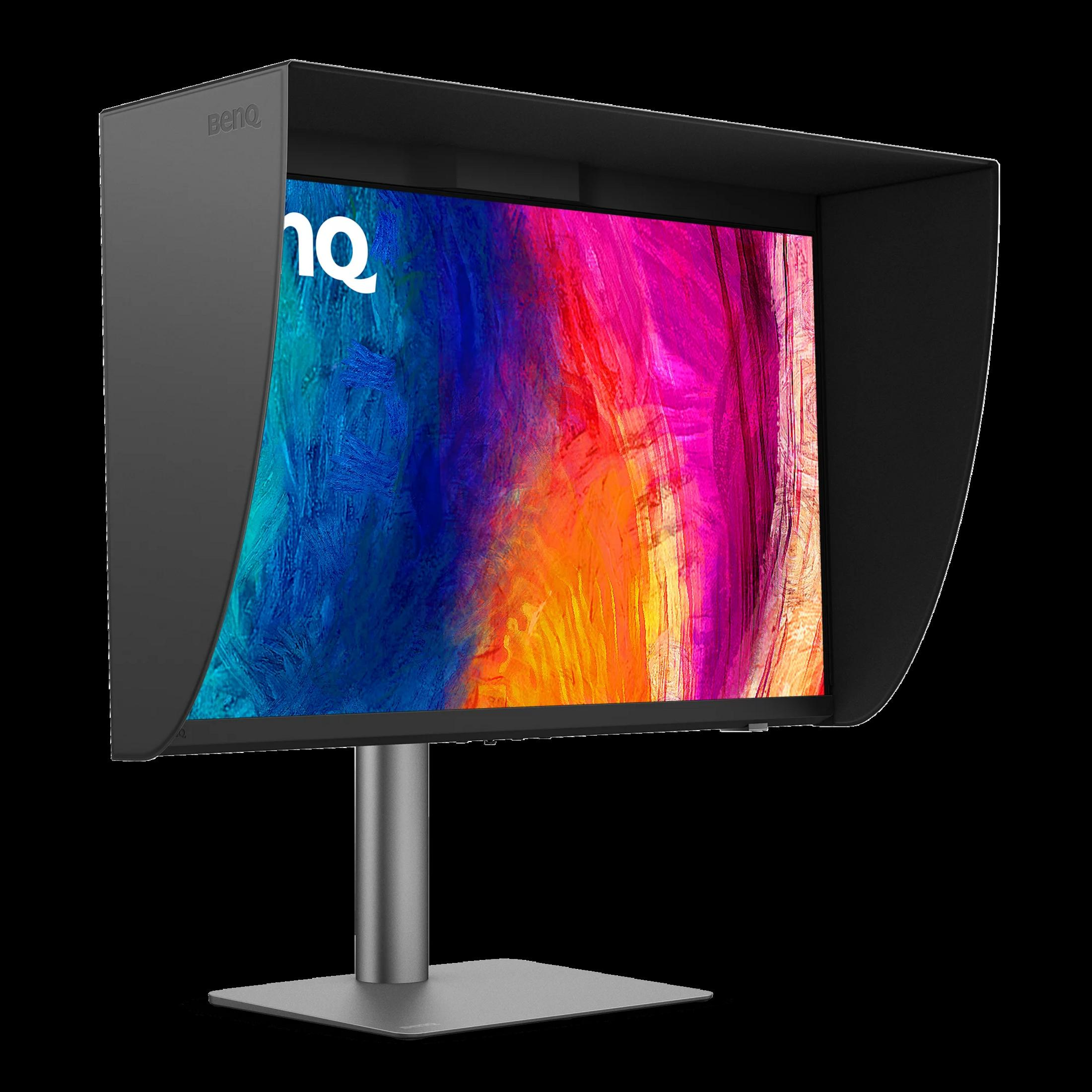 Un monitor BenQ con capucha negra muestra una imagen abstracta colorida en un soporte plateado.