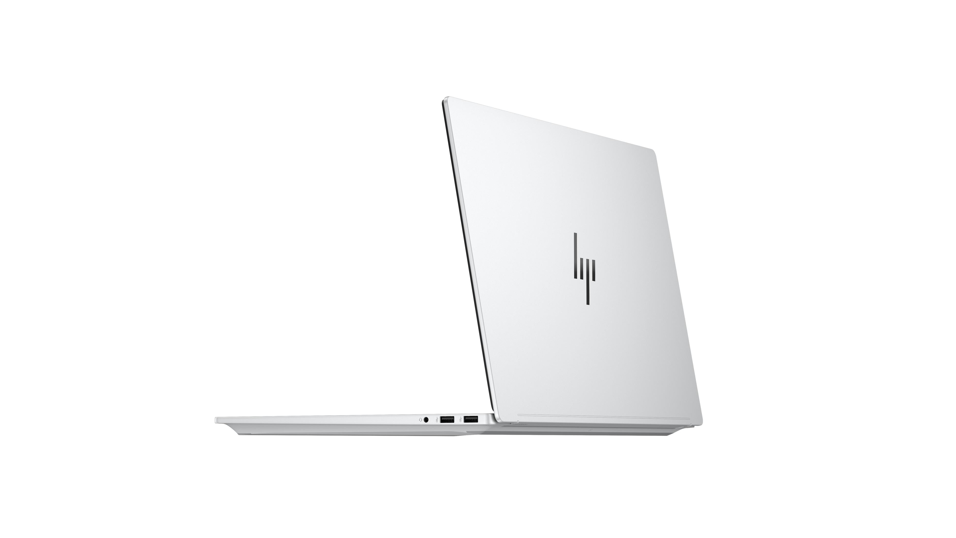Srebrny laptop, częściowo otwarty, z logo HP na pokrywie.