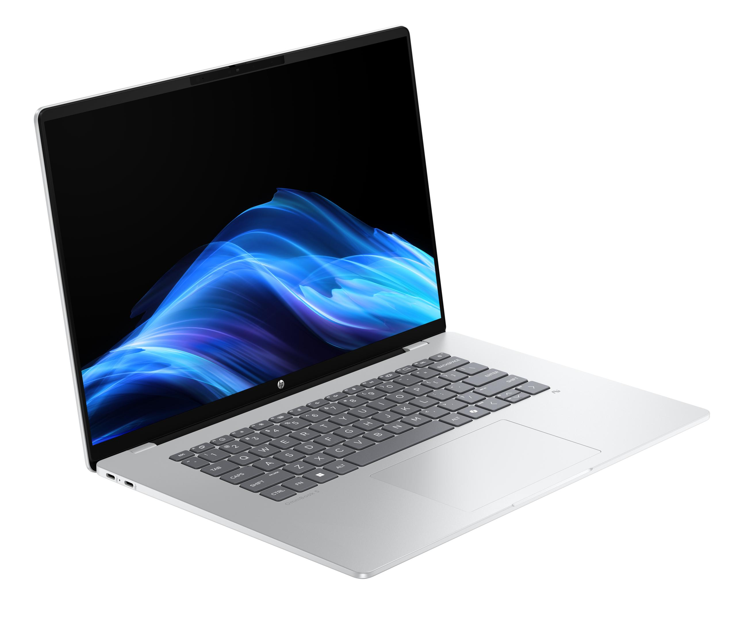 Ein silberner Laptop mit einem blauen Wellenmuster auf dem Bildschirm.