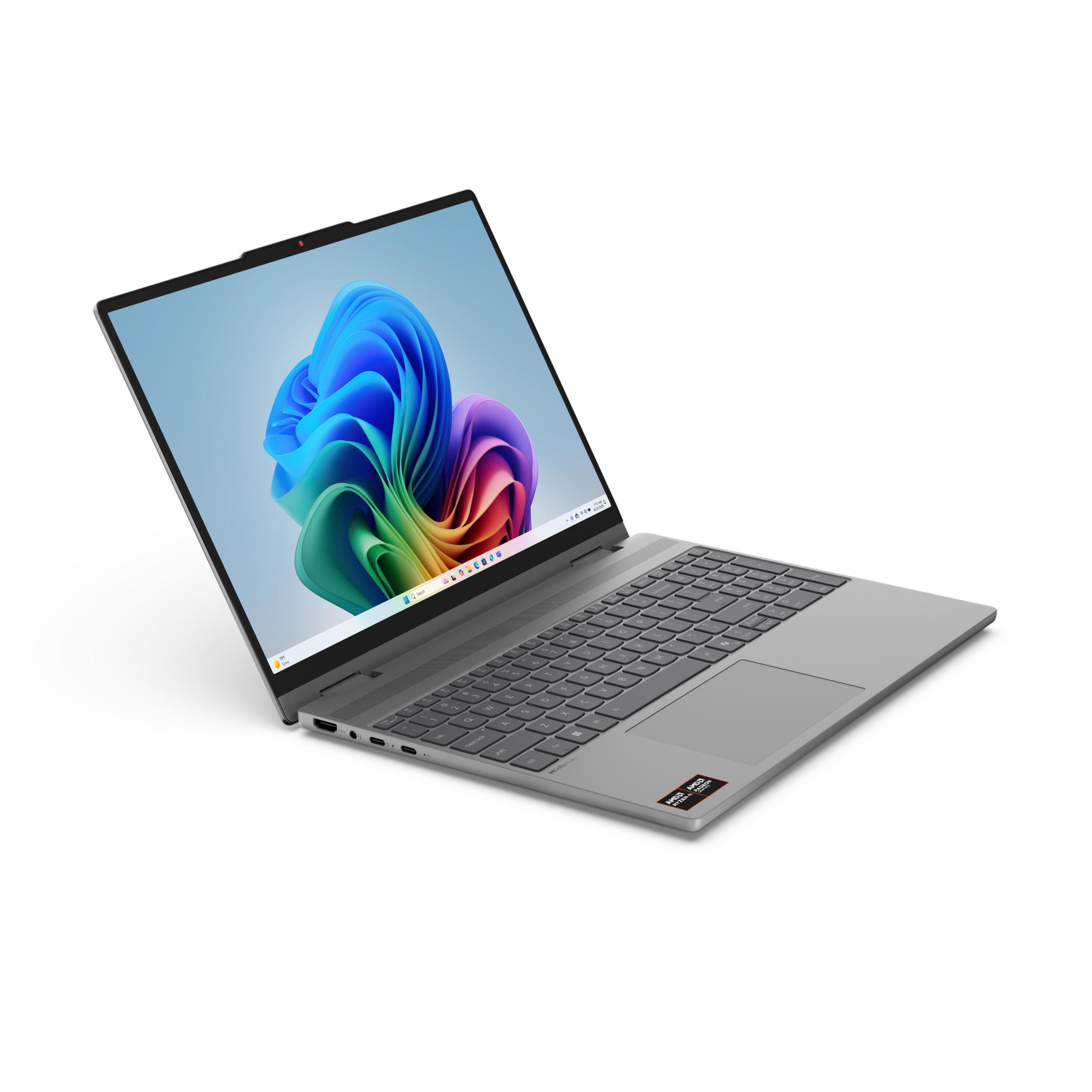 Grauer Laptop mit geöffnetem Bildschirm und farbenfrohem Hintergrundbild.