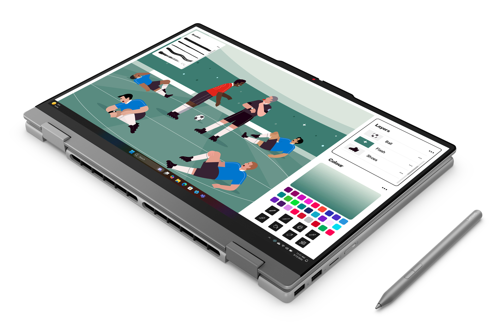 Ein Laptop mit einem Fußballspiel auf dem Bildschirm und einem Stift daneben.