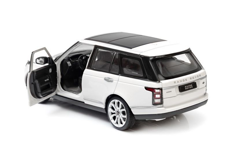 Biały Range Rover zabawkowy z otwartymi drzwiami i czarnym dachem.