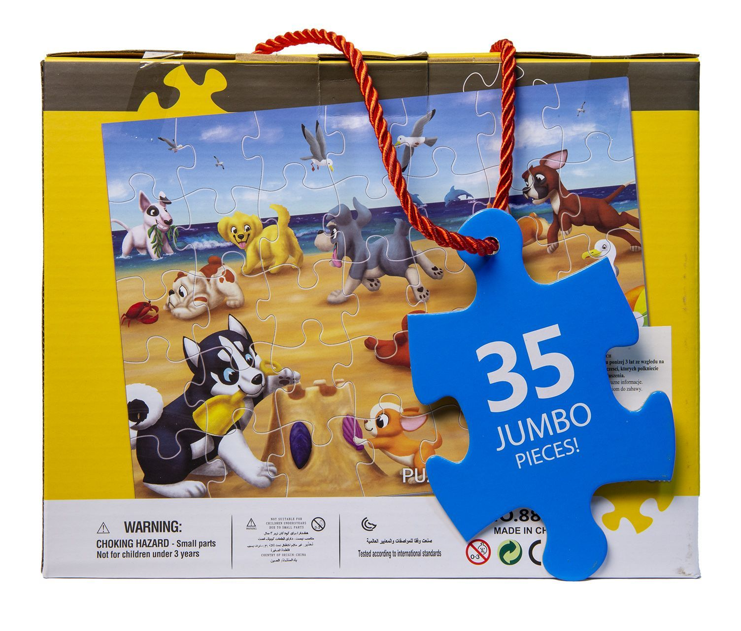 Pudełko z puzzlami przedstawiającymi psy na plaży. Duży niebieski element puzzli z przodu.