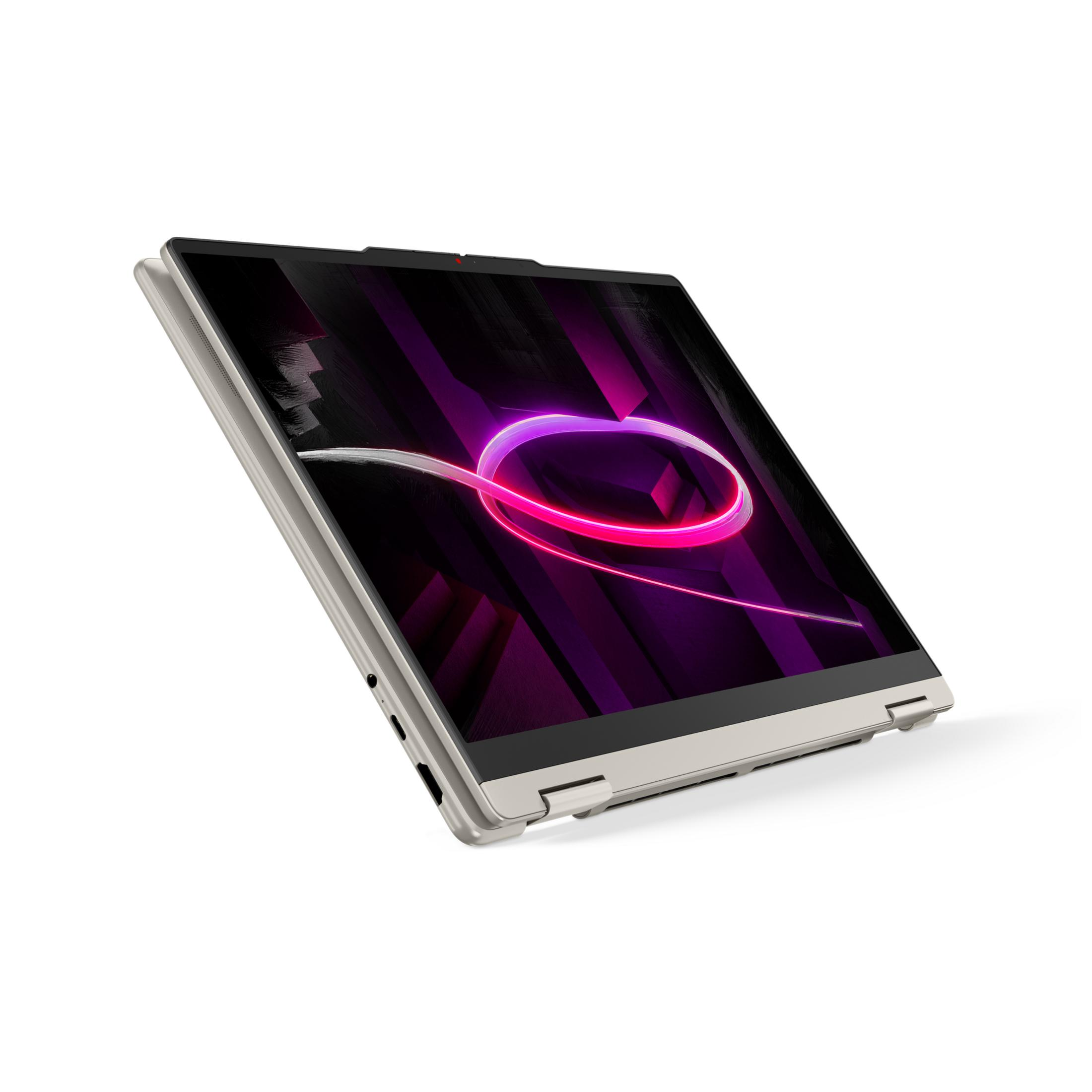 Ein silberner Laptop mit einem lila und pinken abstrakten Hintergrund auf dem Bildschirm.