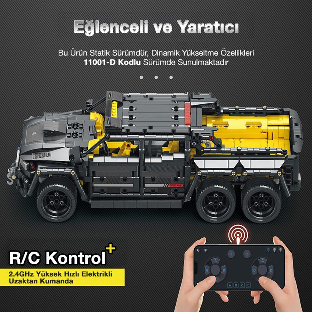 Gri ve sarı uzaktan kumandalı kamyon, kumandasıyla.