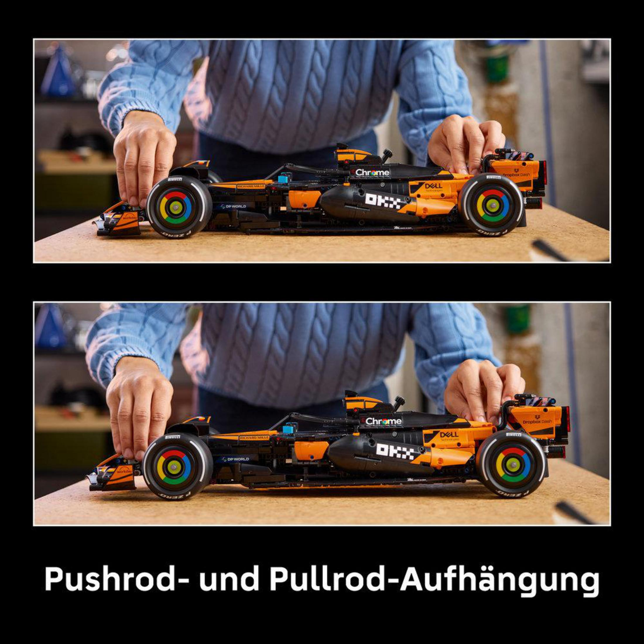 Mężczyzna buduje pomarańczowo-czarny model samochodu F1.