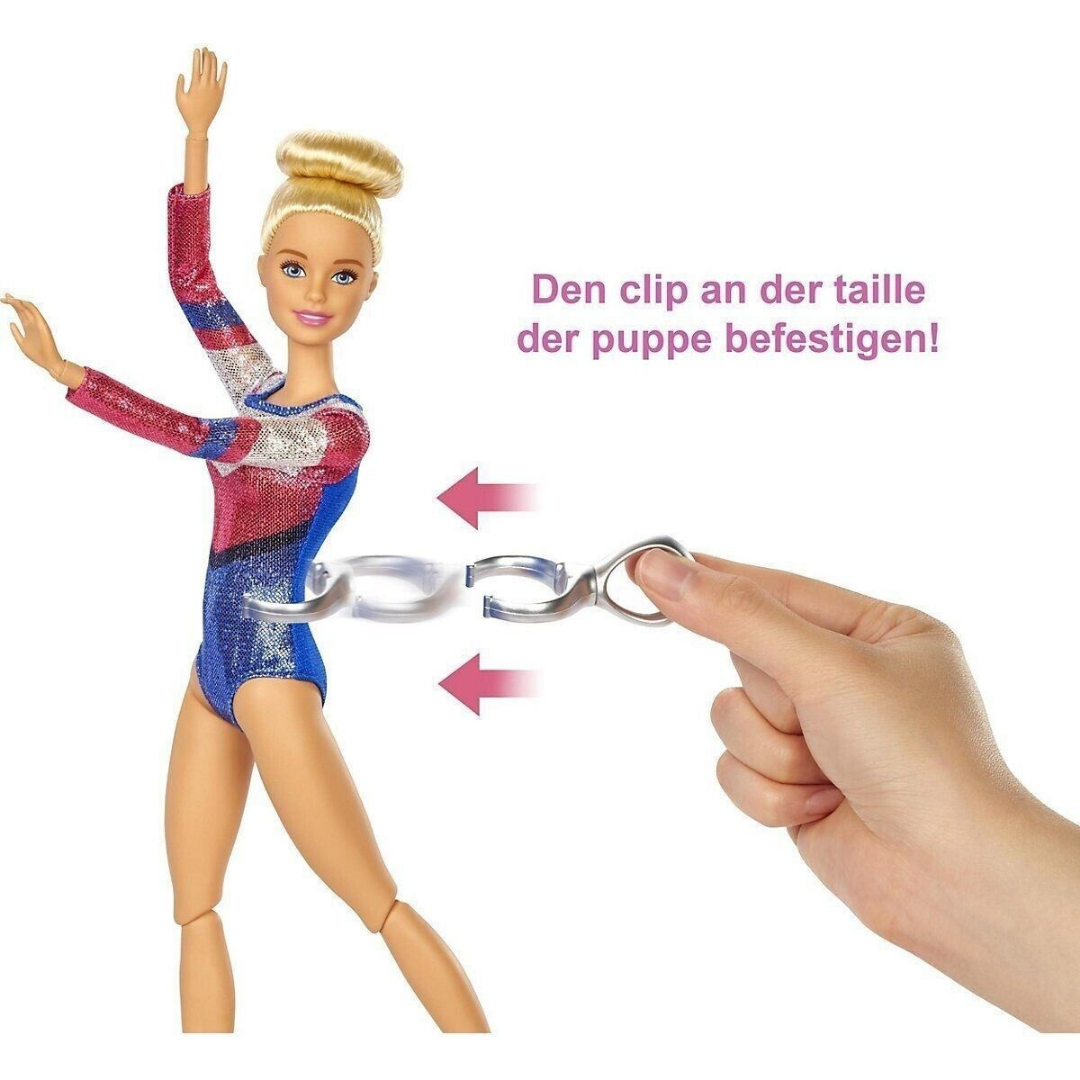 Eine Barbie-Puppe in einem Turnanzug mit einem Clip, der an ihrer Taille befestigt wird.