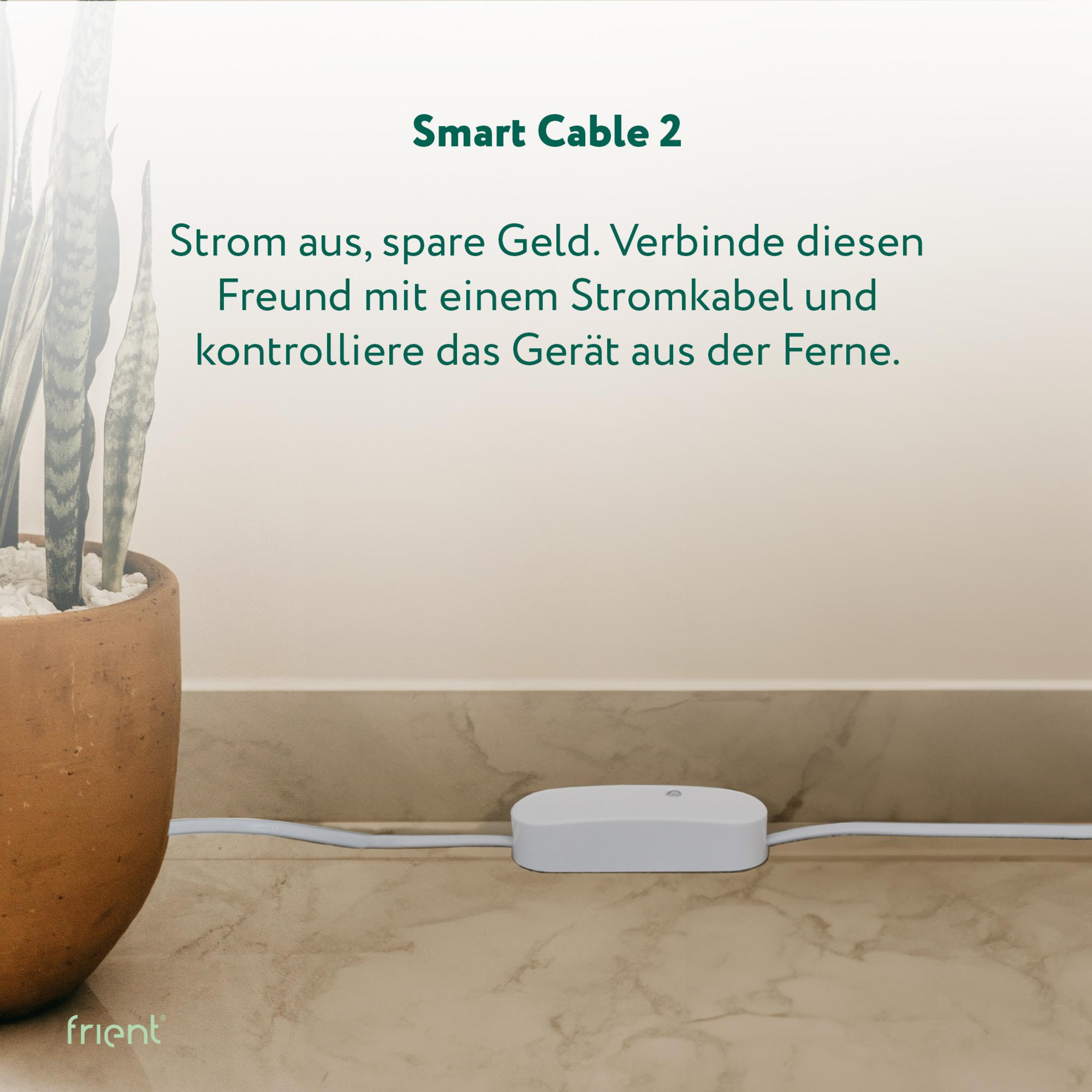 Ein weißes Smart Cable 2 Gerät liegt auf einem Marmorboden neben einer Pflanze.