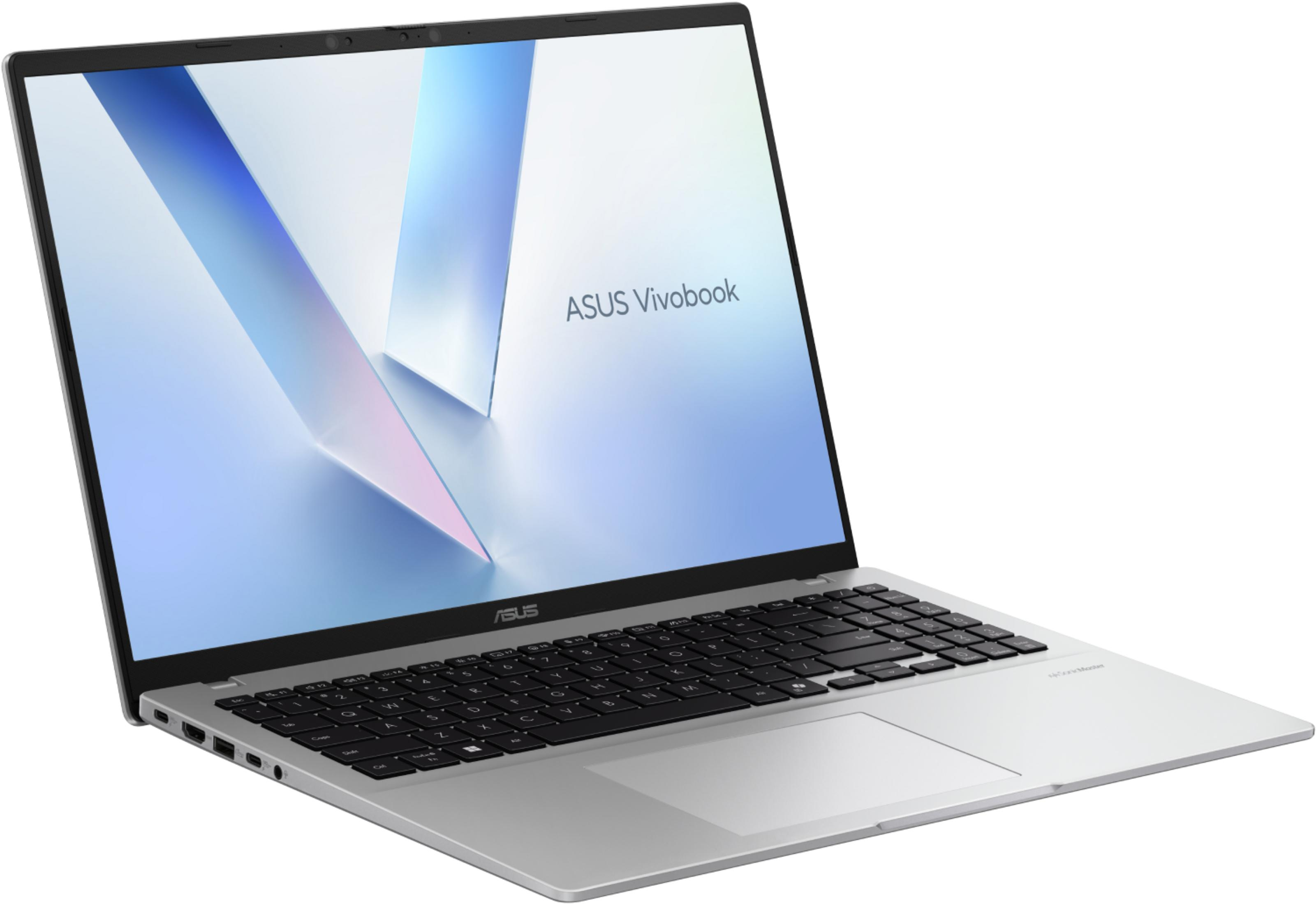 Un portátil plateado ASUS Vivobook está abierto, mostrando teclado y touchpad.