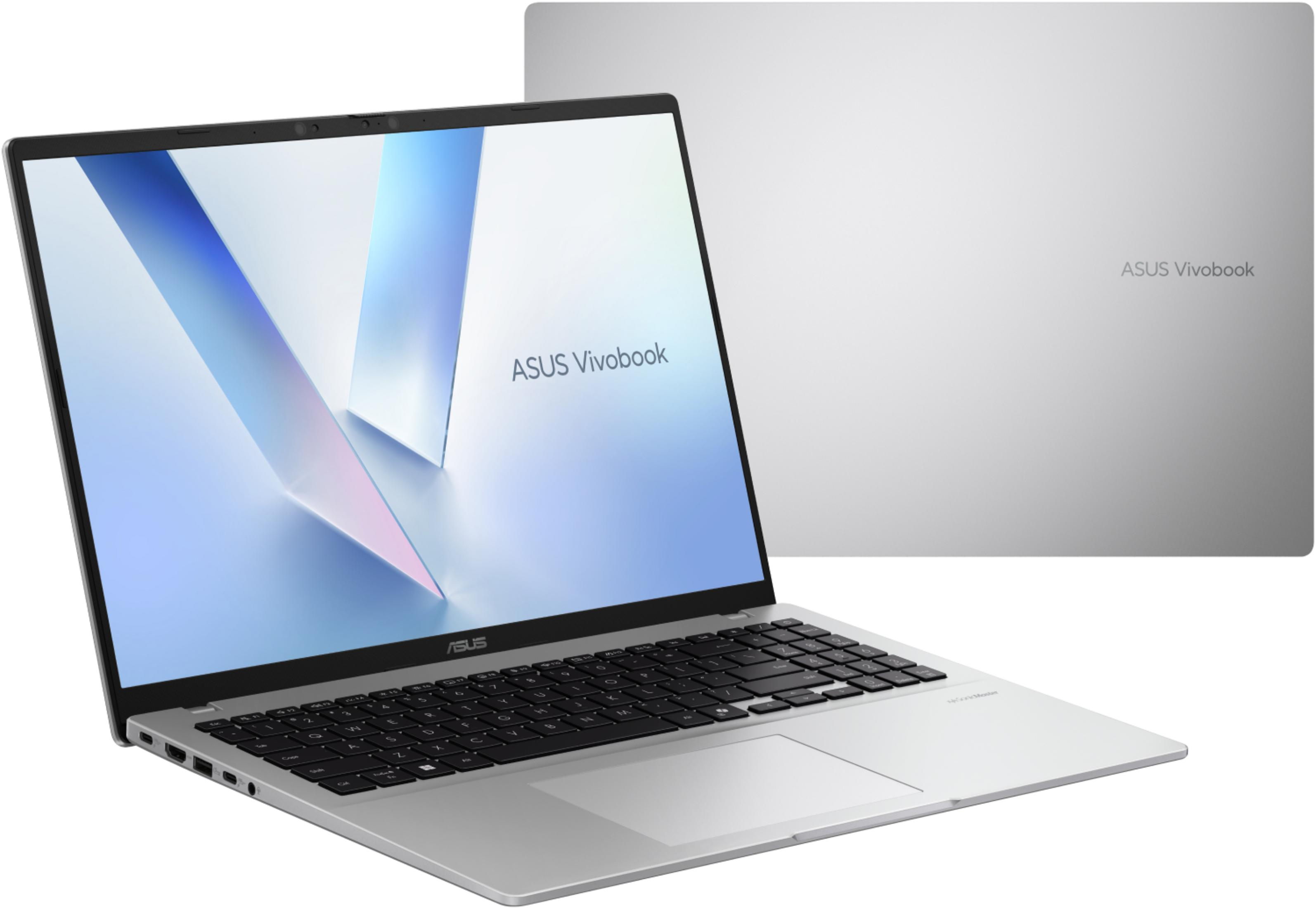 Un portátil ASUS Vivobook plateado está abierto, mostrando el teclado y el panel táctil.