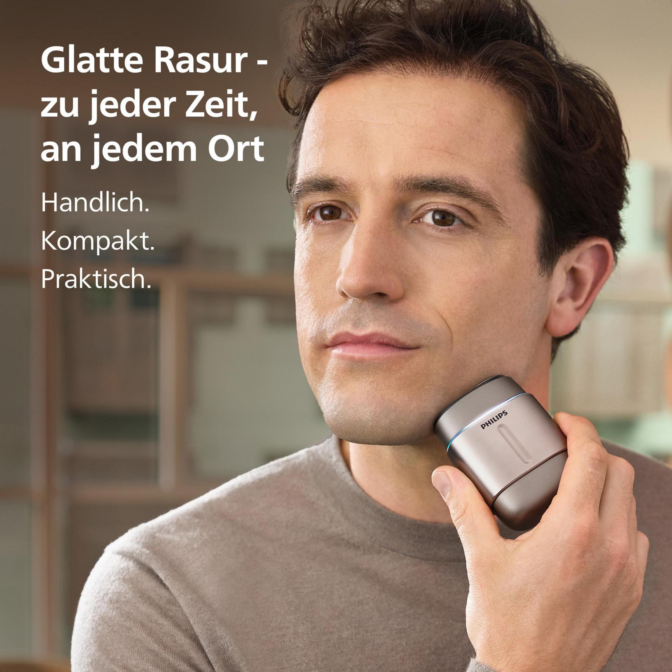 Ein Mann rasiert sich mit einem Philips Rasierer im Gesicht.