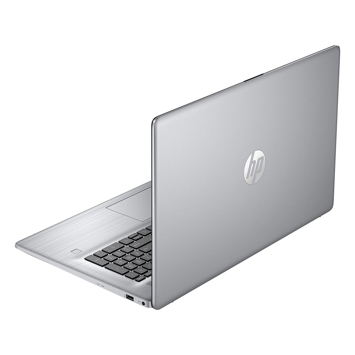 Srebrny laptop HP z klawiaturą i touchpadem, widziany od tyłu po prawej.