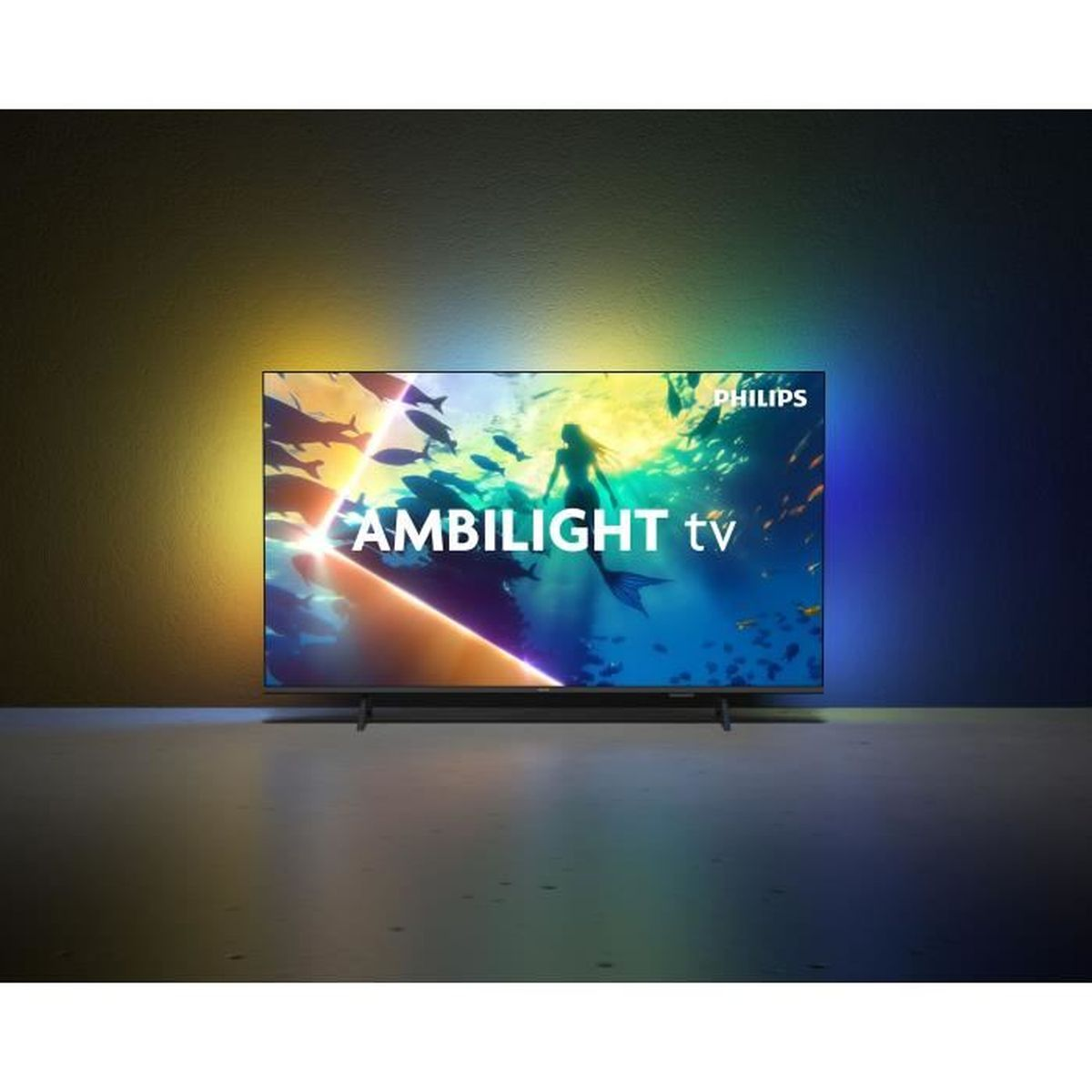 Una TV Philips Ambilight mostra una scena subacquea con sirena e pesci.