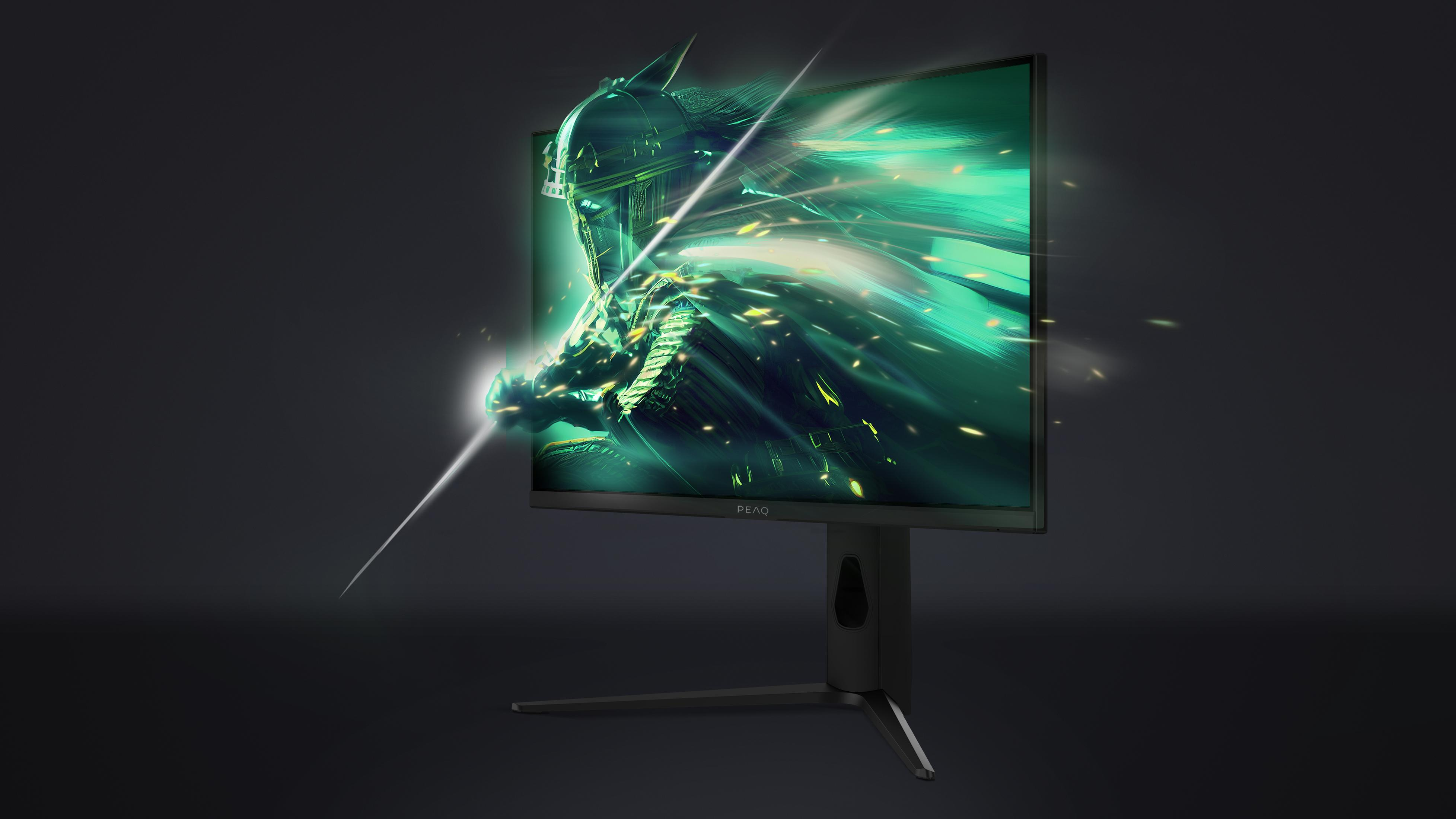 Ein Monitor zeigt ein grünes, futuristisches Kriegerbild mit Lichteffekten.