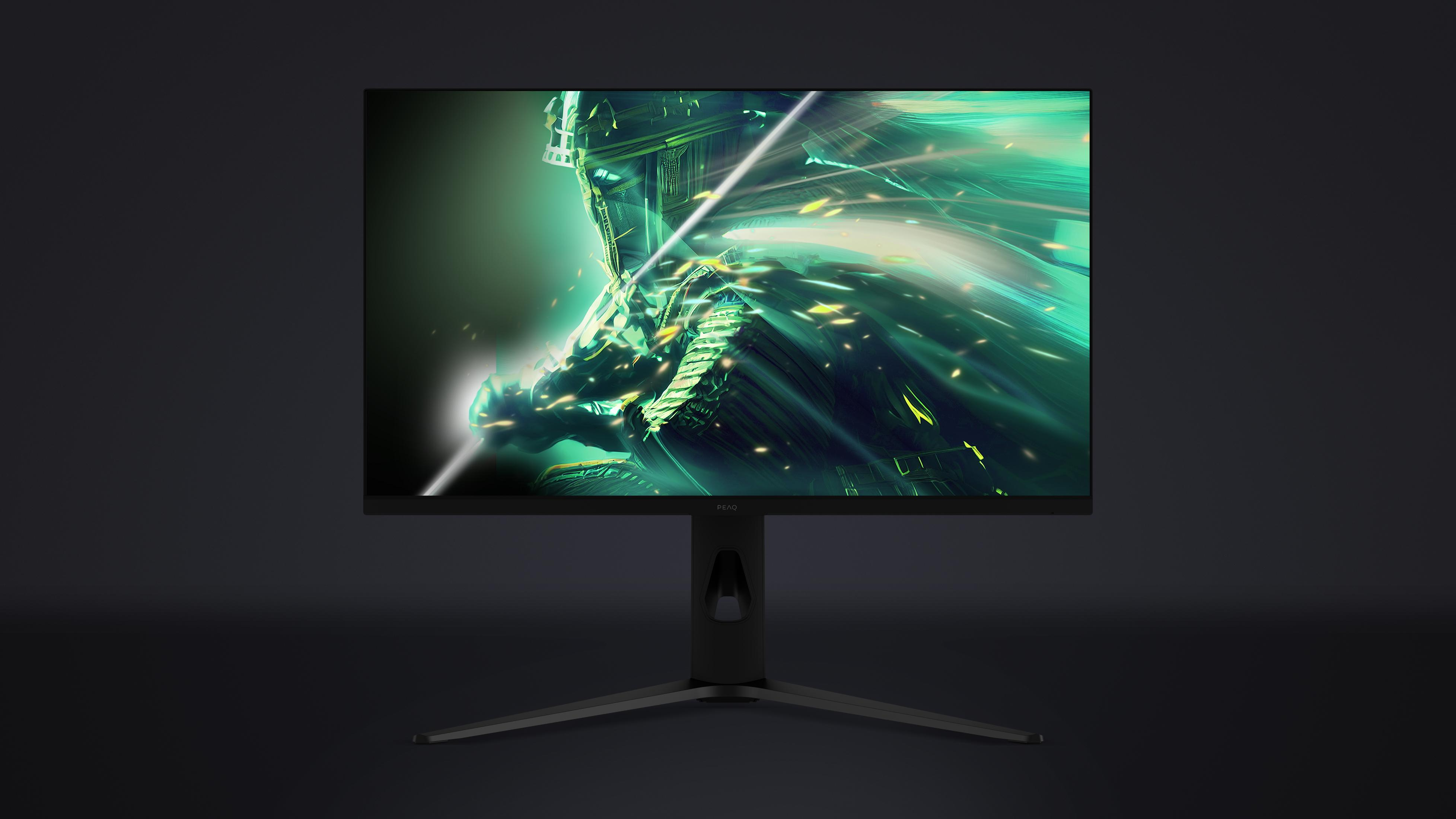 Ein Monitor zeigt ein grünes, futuristisches Bild mit Lichtstrahlen und Partikeln.