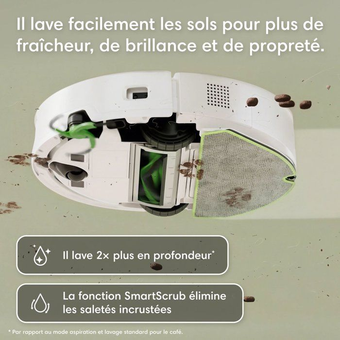 Un robot aspirapolvere bianco con spazzola pulisce un pavimento sporco.