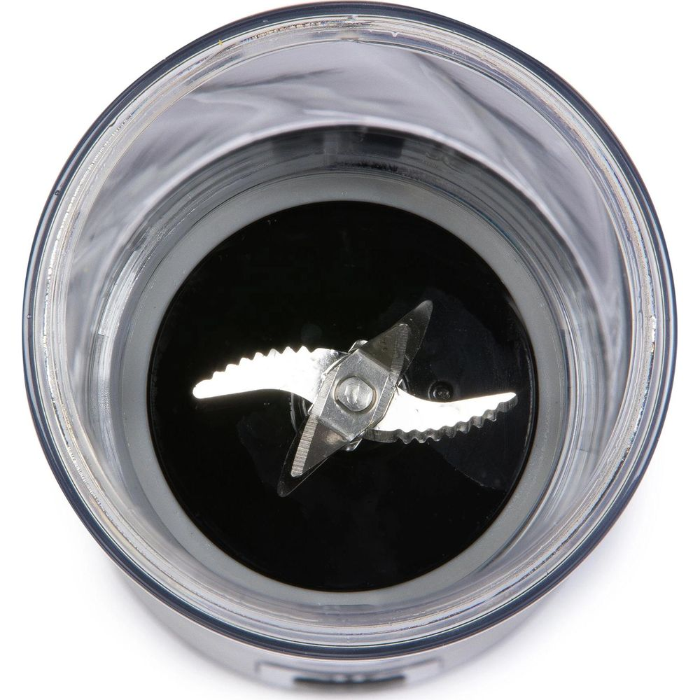 Lames métalliques acérées dans un cercle noir, à l'intérieur d'un récipient transparent.