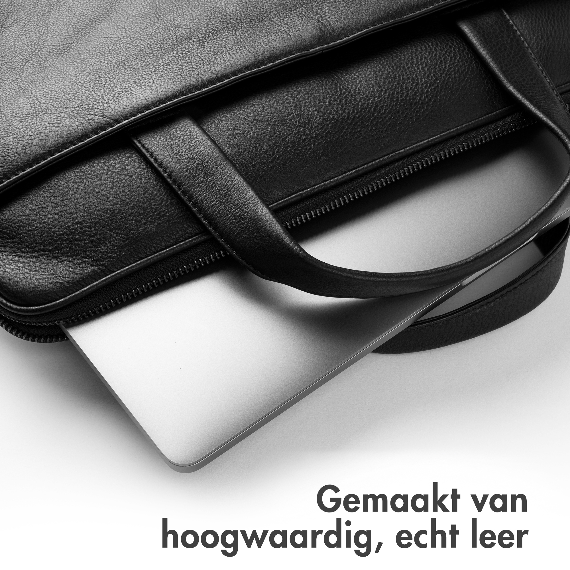 Zwarte leren tas met laptop, gemaakt van echt leer.